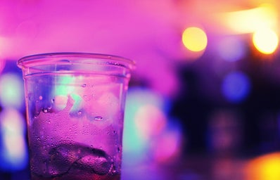 An alcoholic beverage stands out in the midst of a blue background