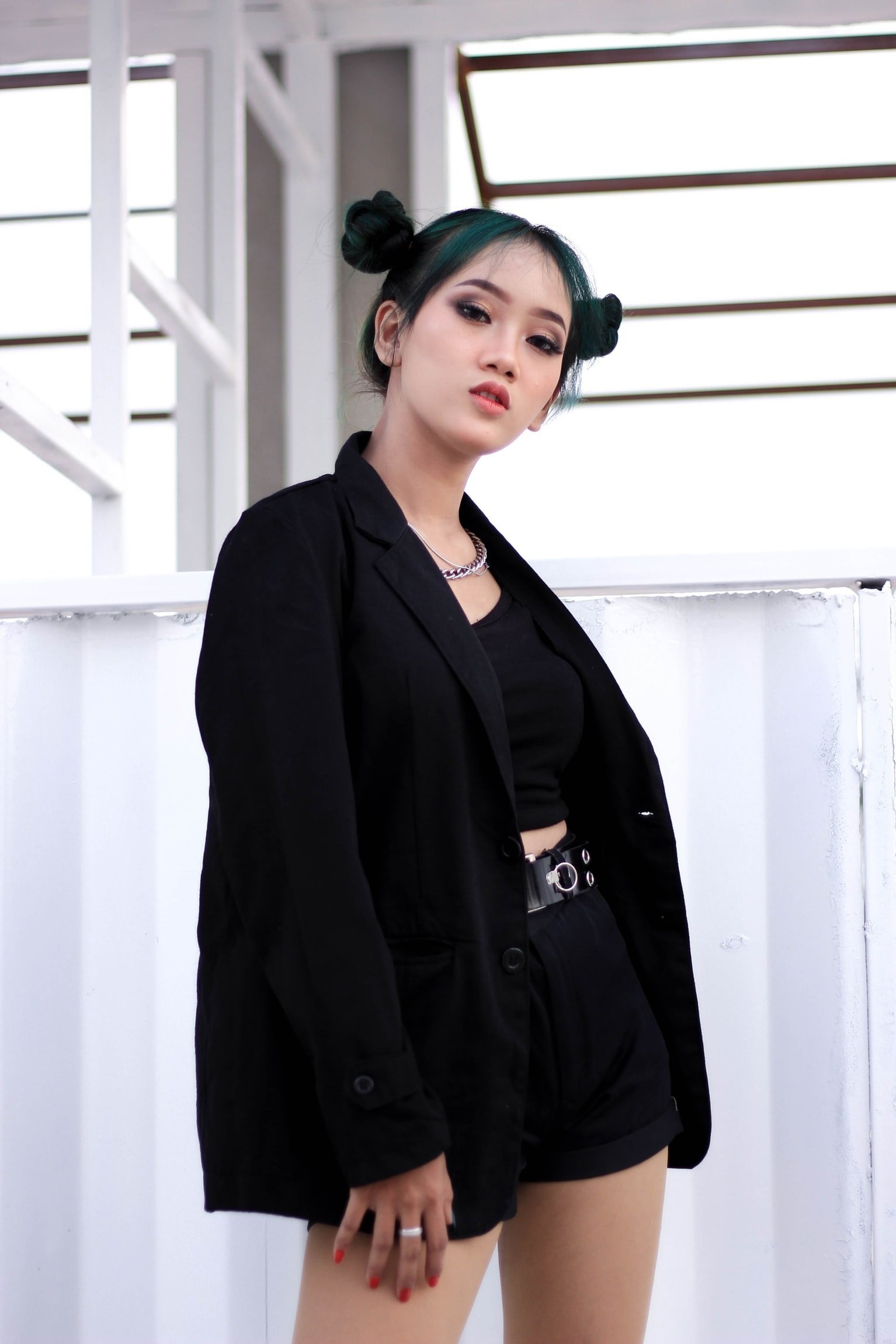 woman in all-black outfit looking at camera