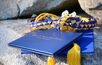Blue diploma with white and blue tassle