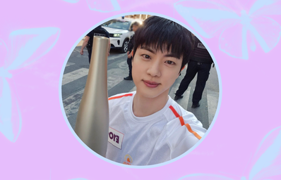 BTS\' Jin holding the 2024 Summer Olympics torch