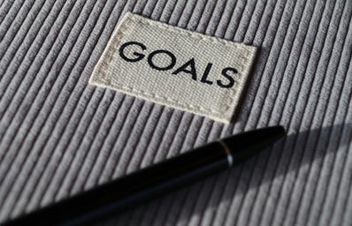 goals text with gray ribbed background and black pen