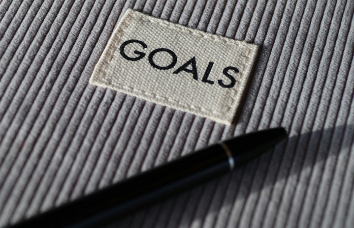 goals text with gray ribbed background and black pen