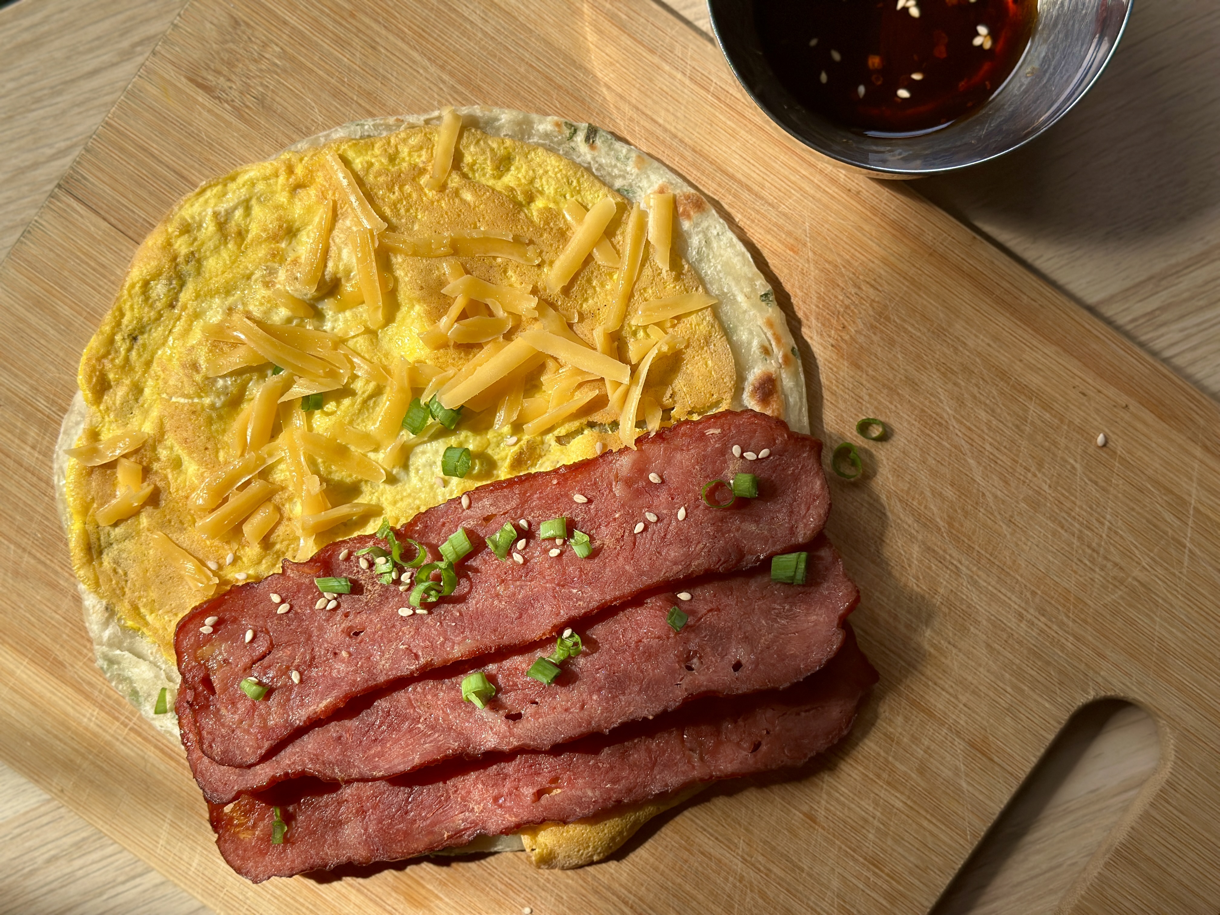 Scallion pancake breakfast sandwich with sauce