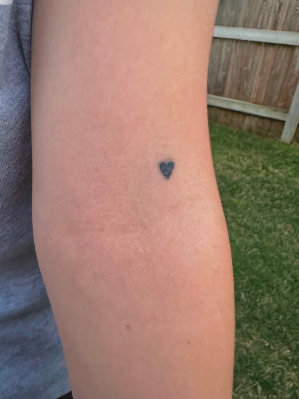 heart tattoo on inside of left elbow