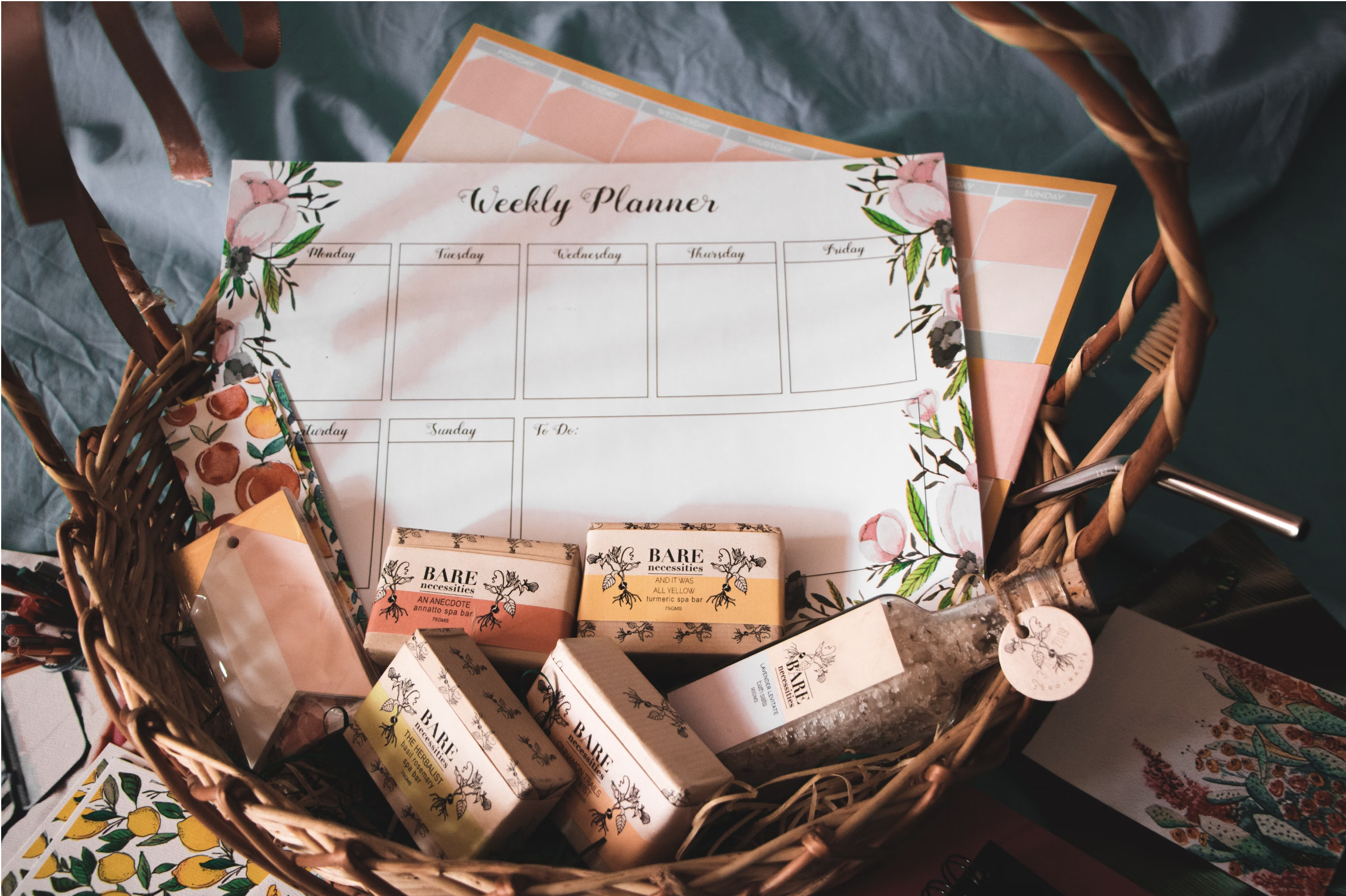 brown wicker basket filled with cosmetic boxes