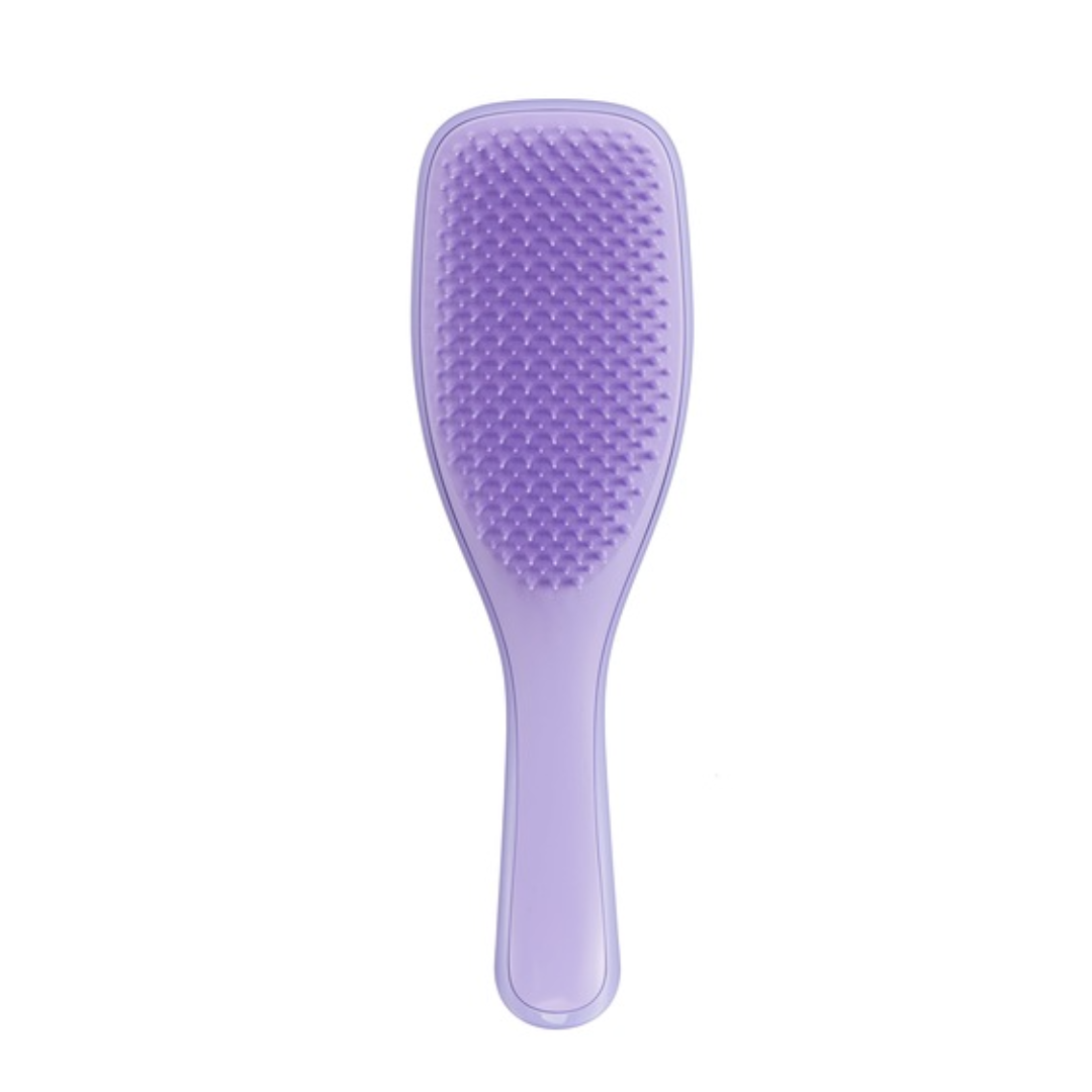 purple plastic hairbrush