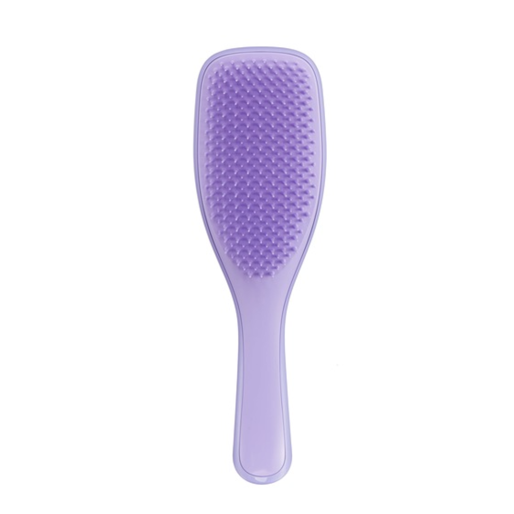 purple plastic hairbrush