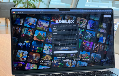 laptop open with Roblox login screen
