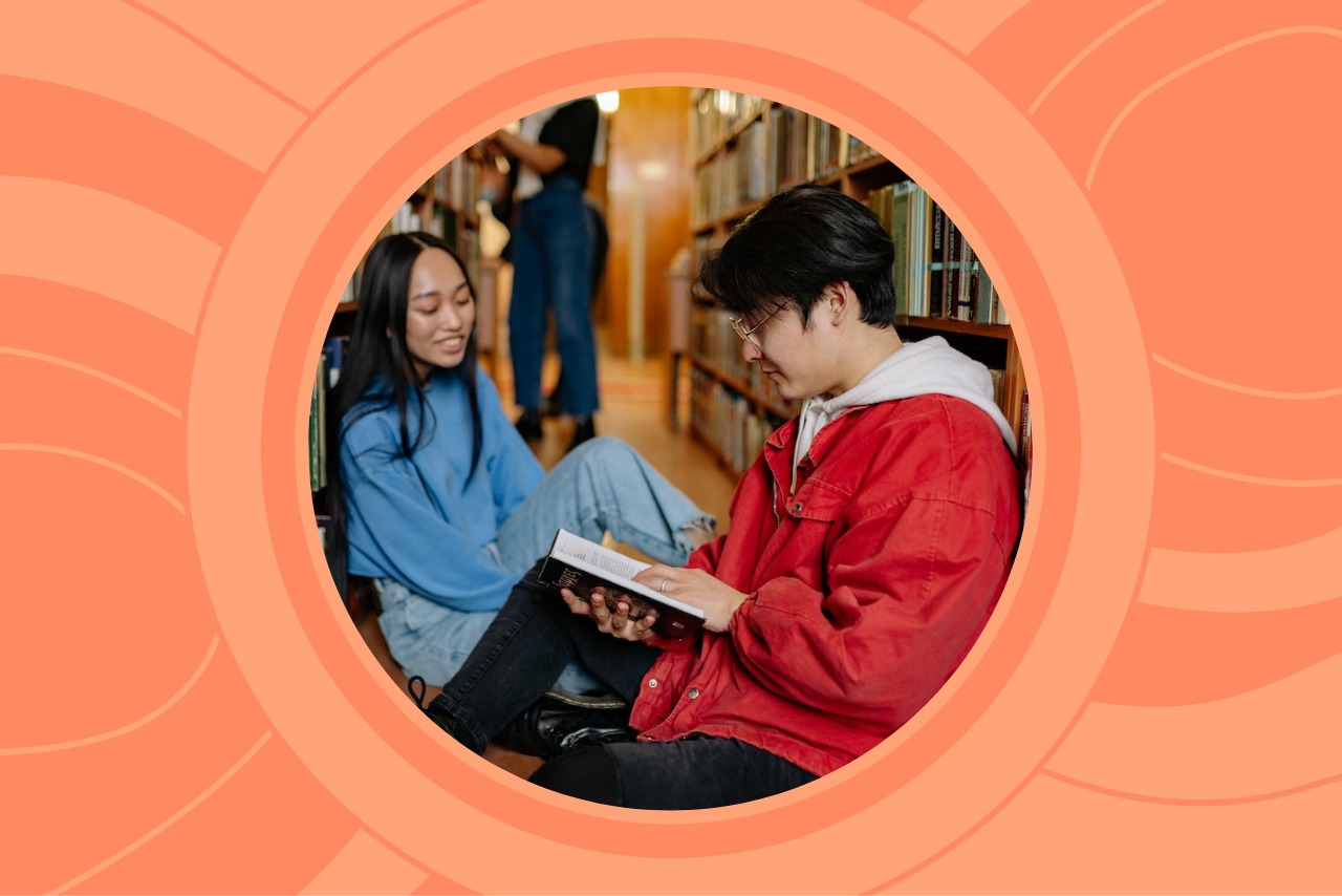 two college students studying in library