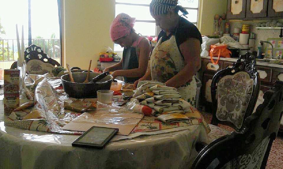 Childhood image of young girl and grandma cooking