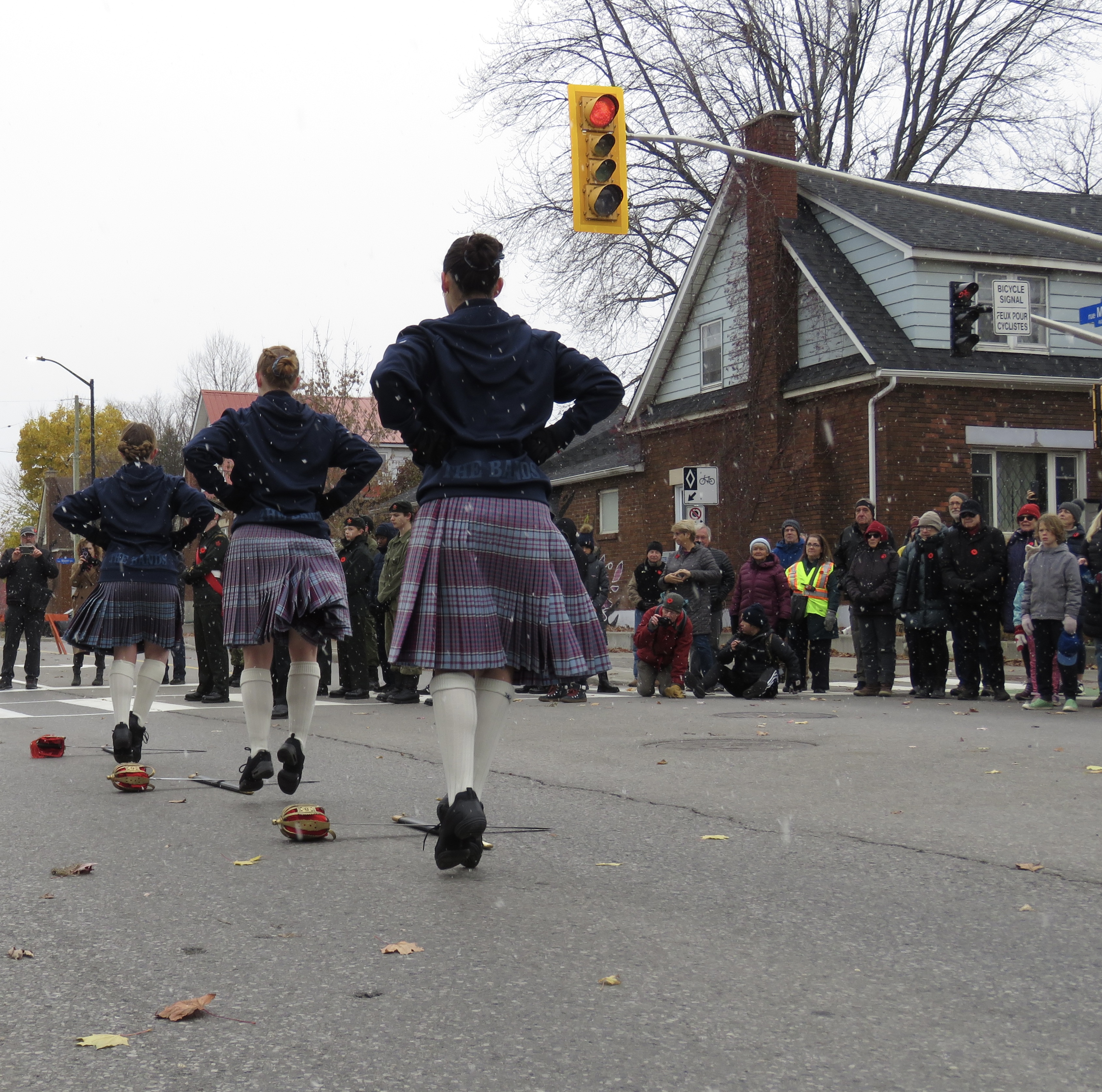 Representative from Royal Canadian Legion Branch 351 placing a wreath at the Brantwood Gates Memorial.