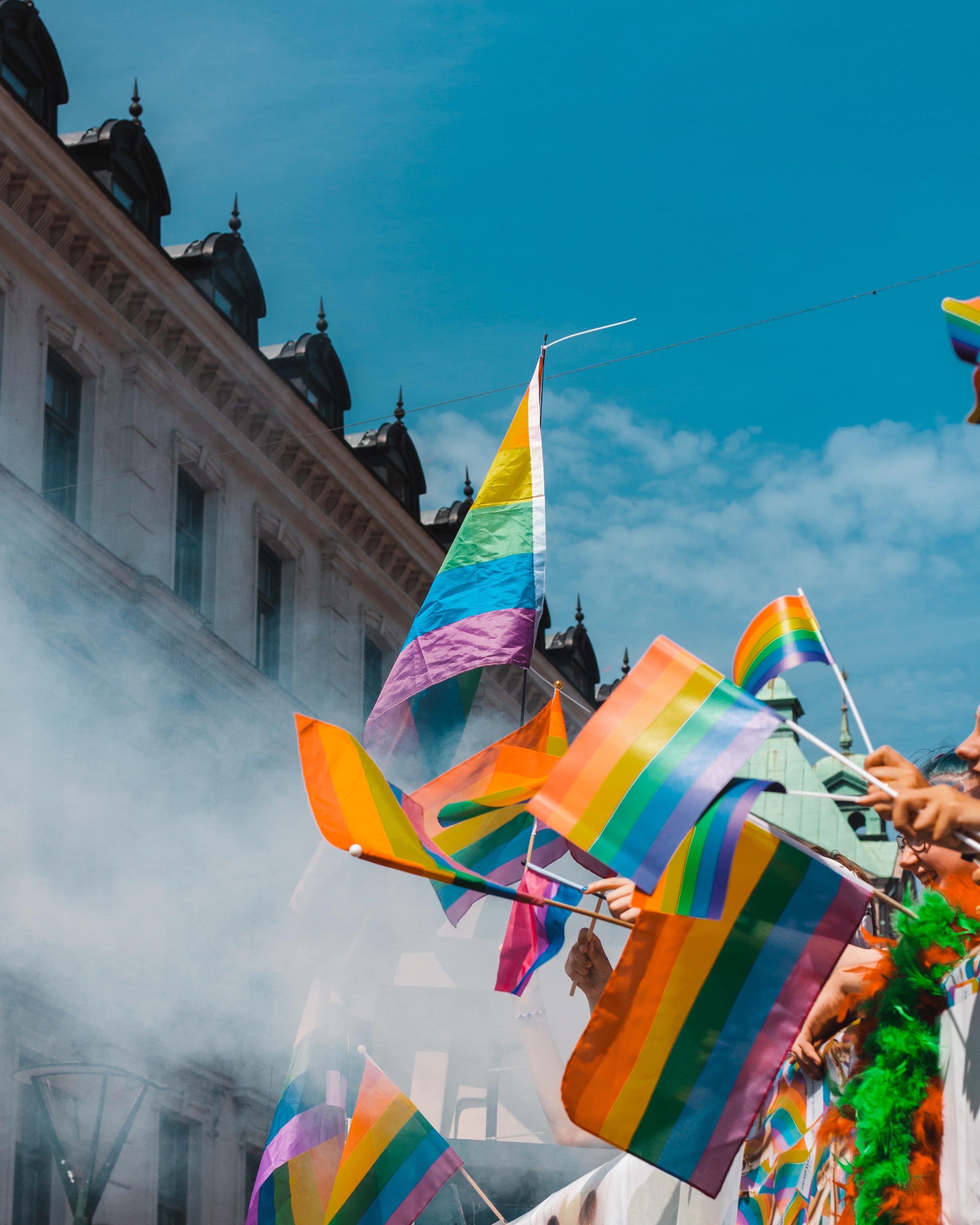 Gay pride flags waving in the air by Teddy sterblom?width=698&height=466&fit=crop&auto=webp&dpr=4