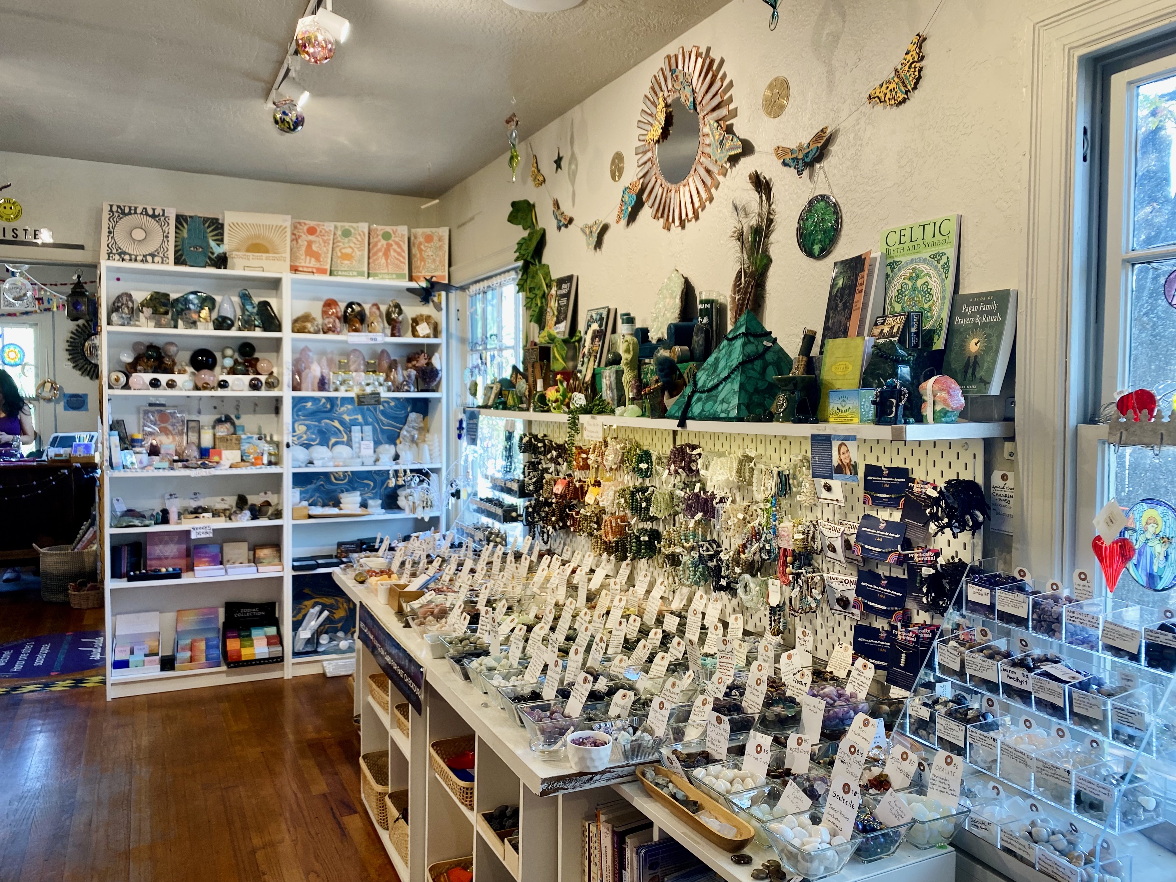 display shelves of crystals and books.