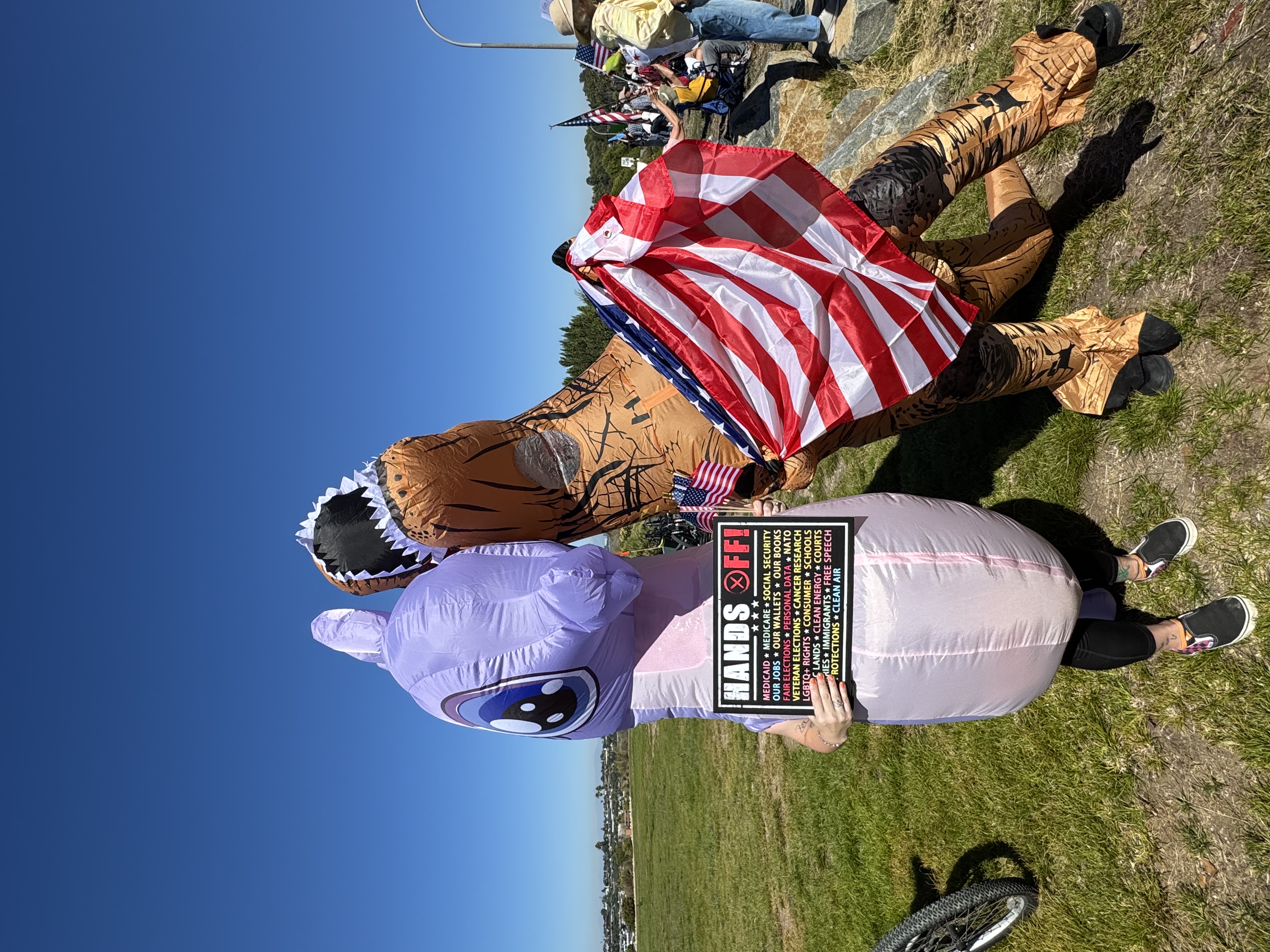From left: Erin and Pascal Weston show their support for the Oct. 18 demonstration in inflatable costumes.