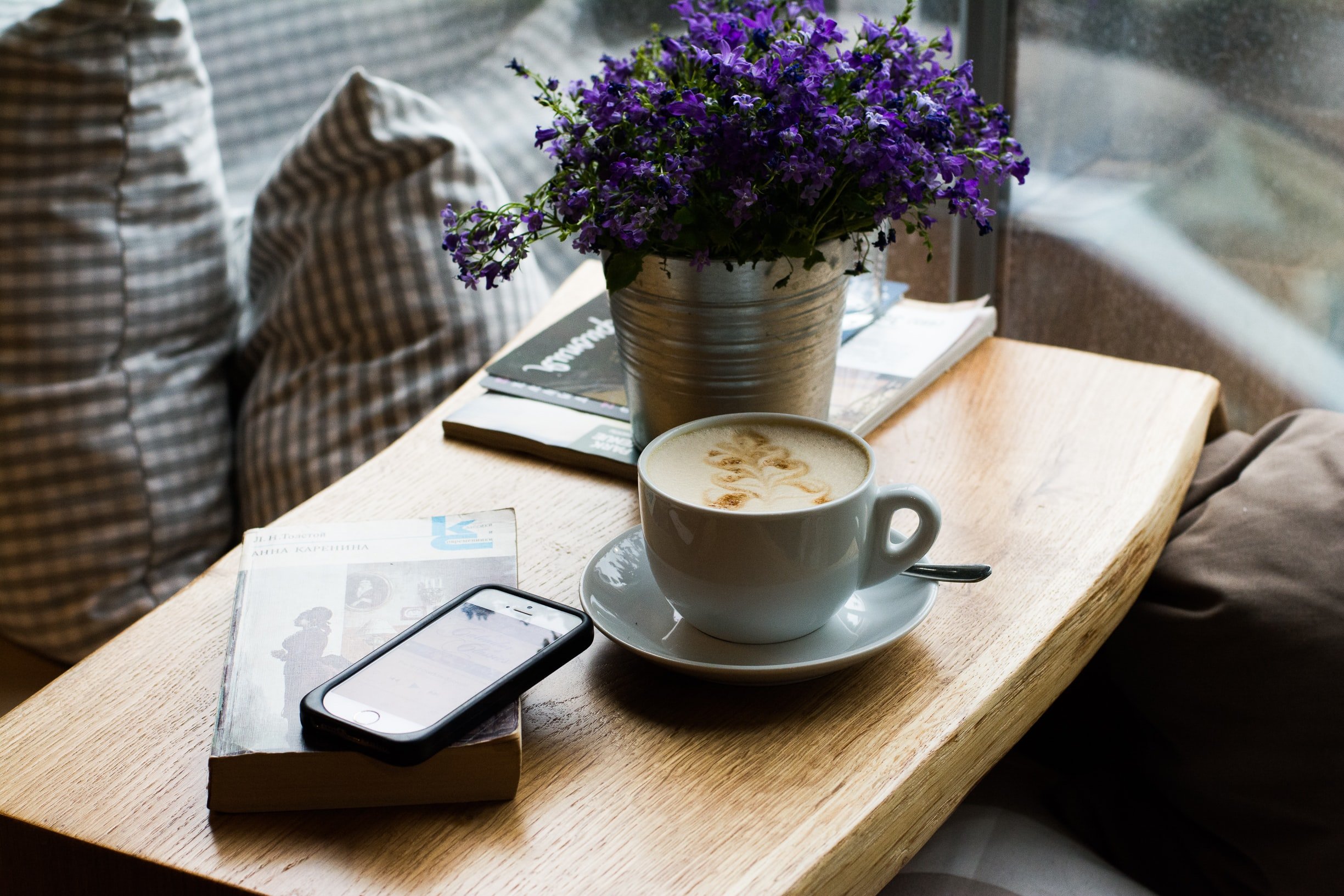 coffee and phone on table by unsplash?width=698&height=466&fit=crop&auto=webp&dpr=4
