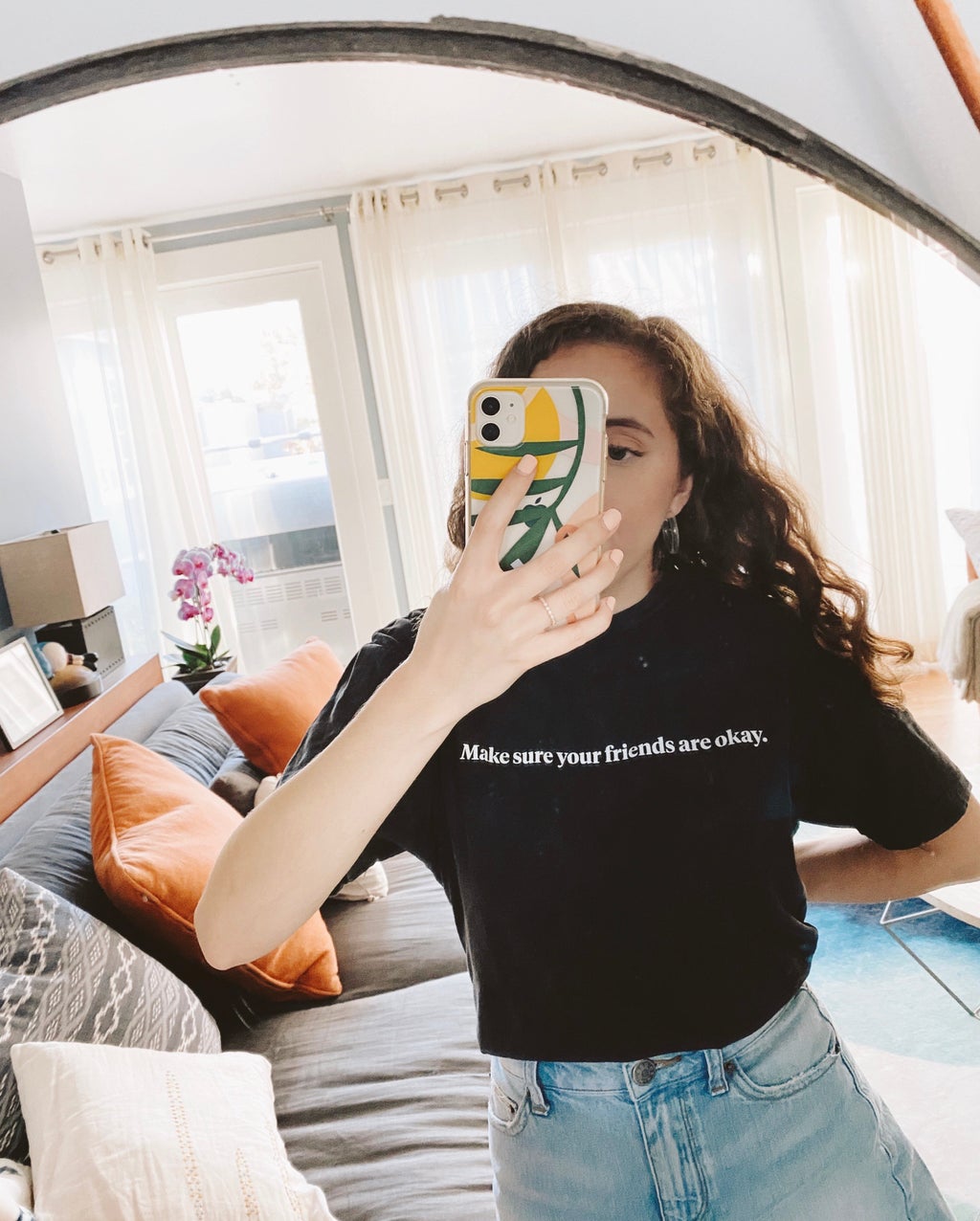 girl wearing t-shirt in mirror selfie