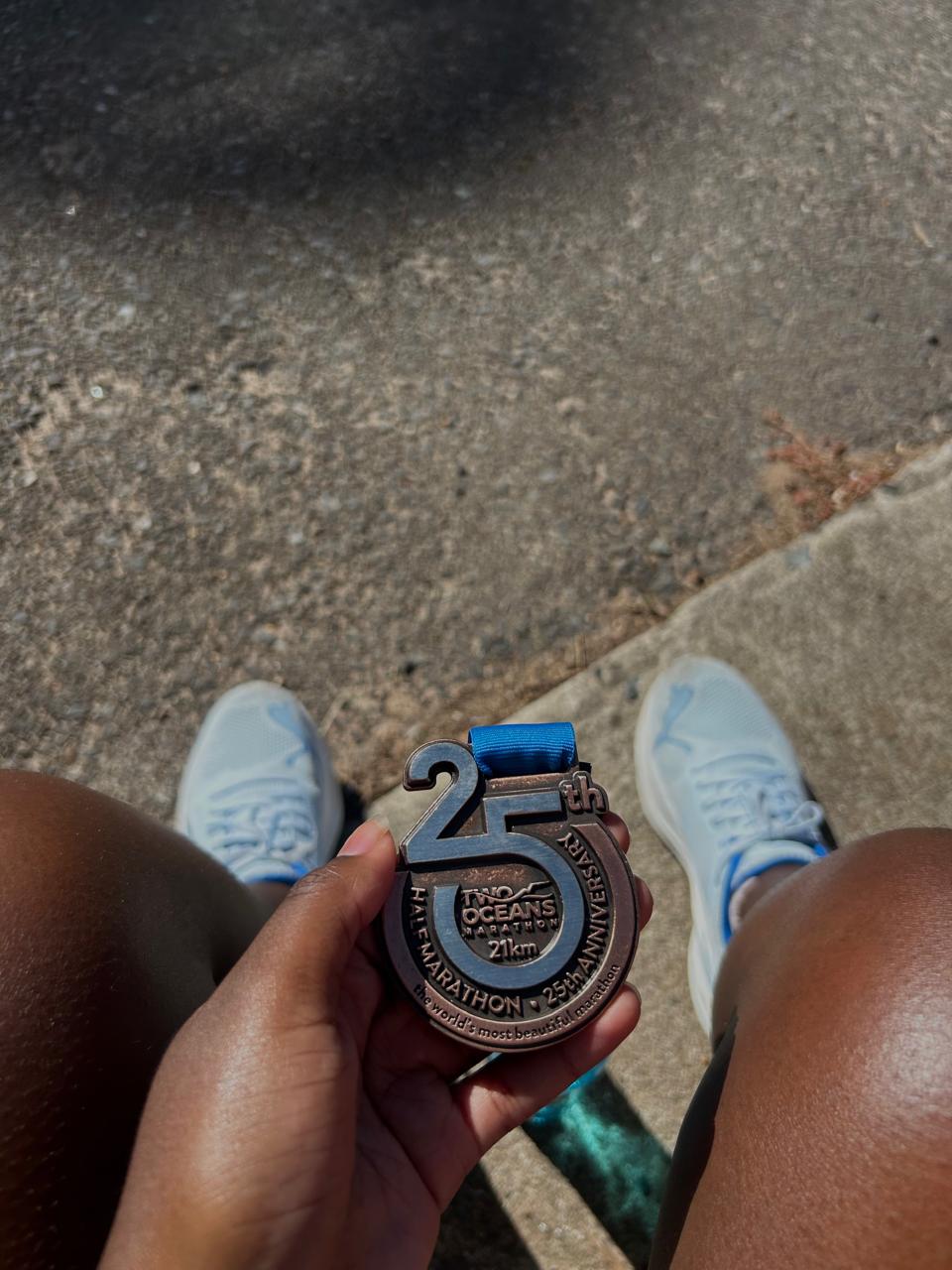 Woman with medal after marathon