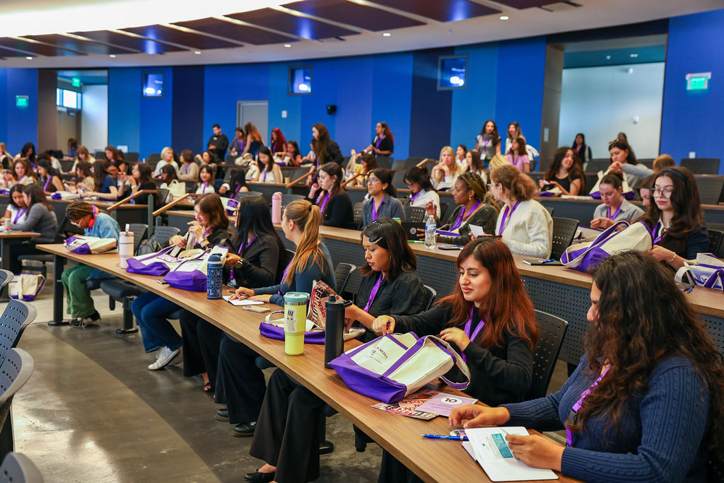 students sitting in conference room
