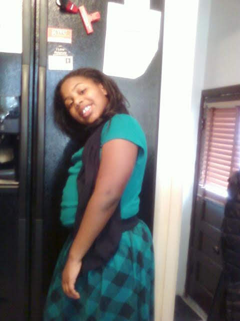 A child in front of the fridge