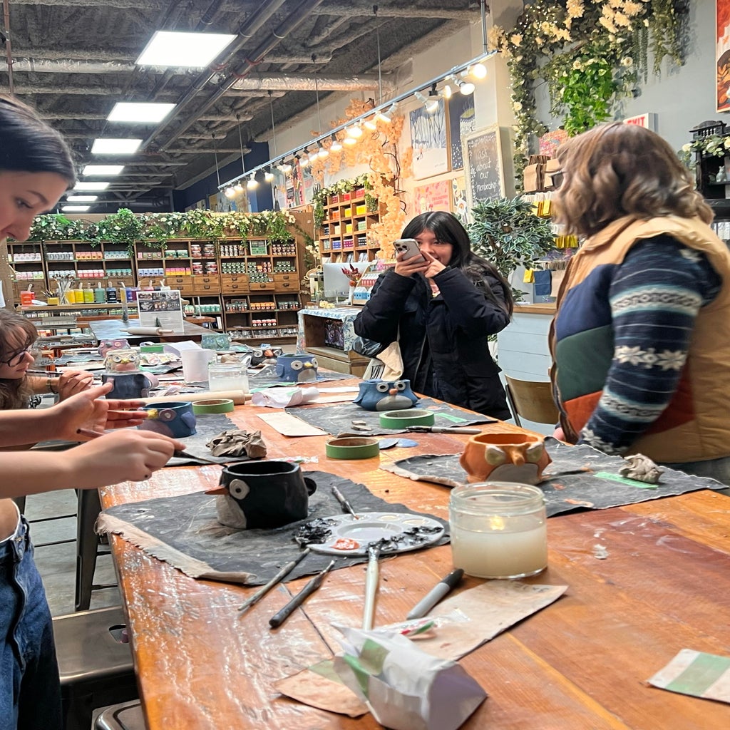 hc uvic members making clay in a pottery studio