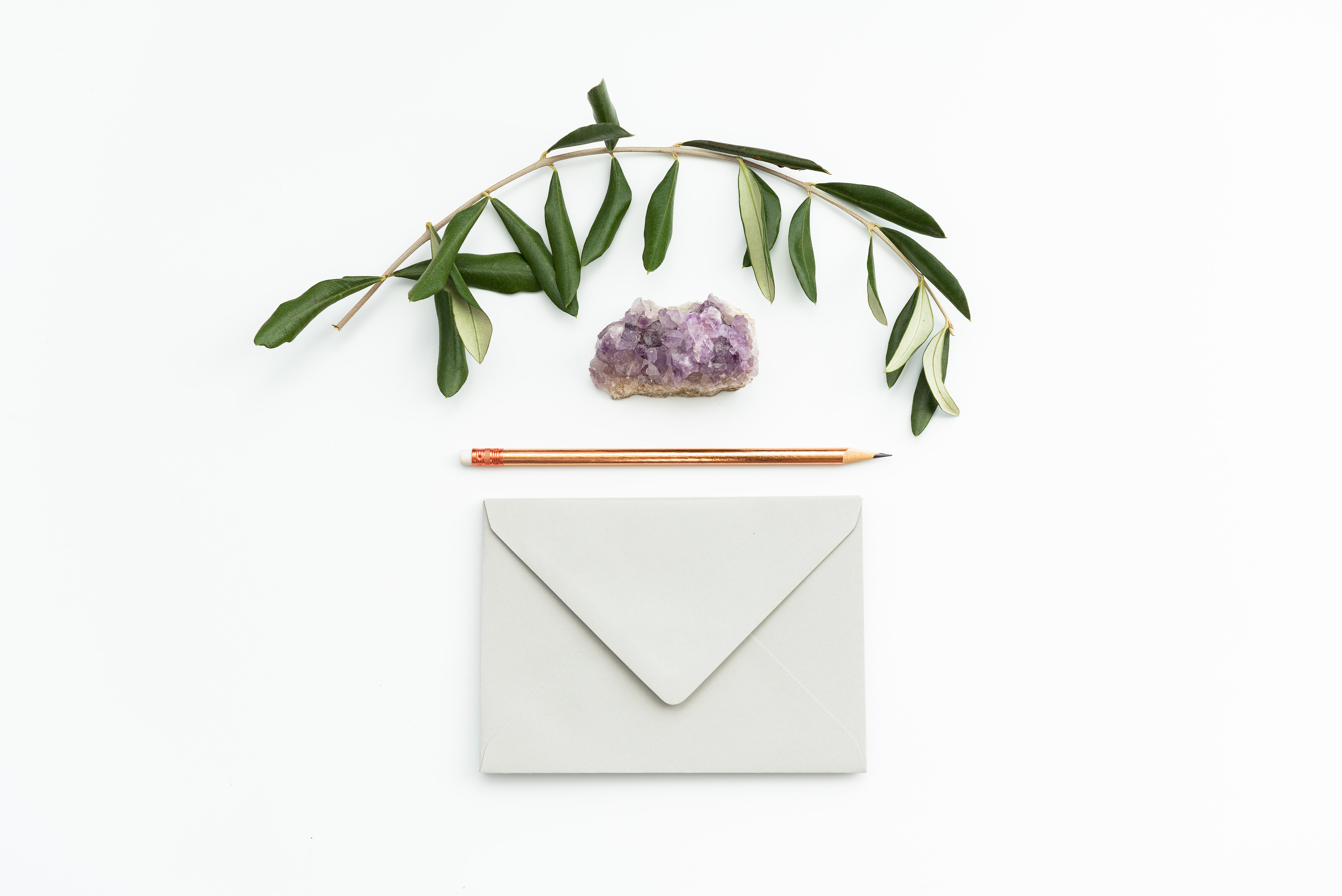 envelope pencil crystal and plant by Joanna Kosinska