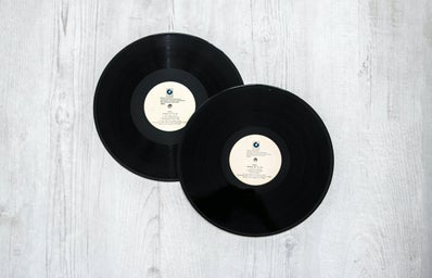 Photography of Vinyl Records On Wooden Surface