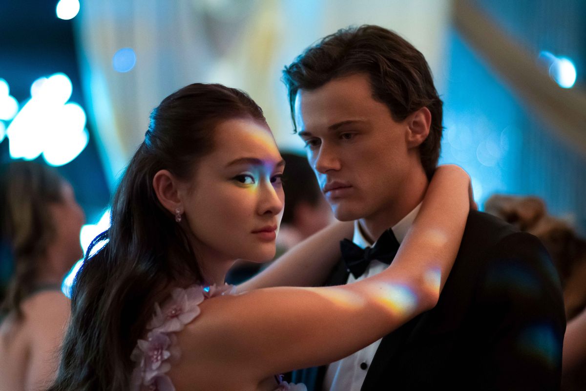 The Summer I Turned Pretty actress Lola Tung and actor Chris Briney at a school dance.