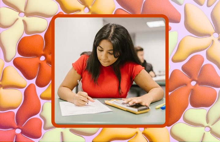 person taking exam with a calculator