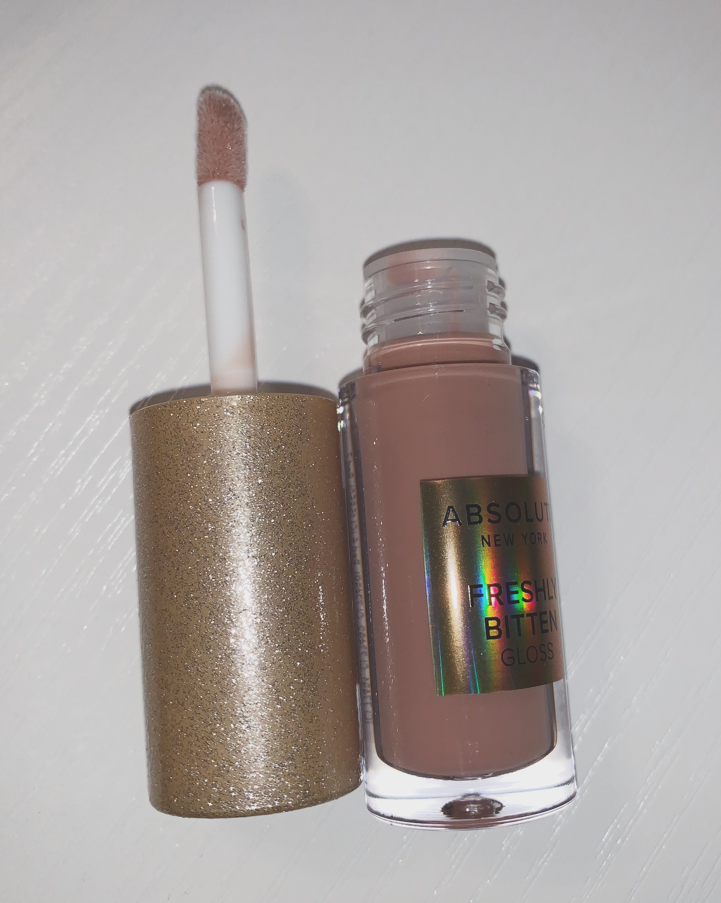 Absolute NY freshly bitten lip gloss against white background