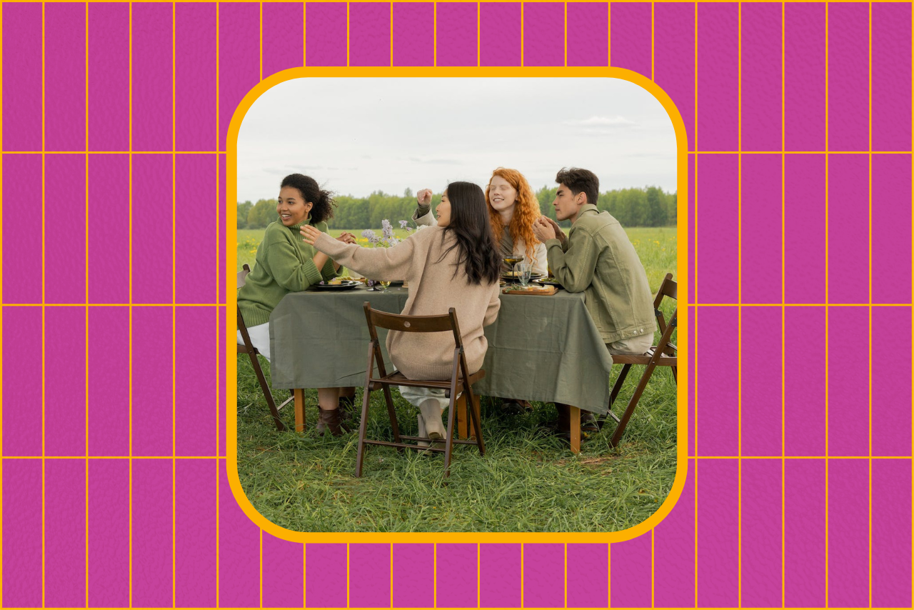 friends eating at a table laughing