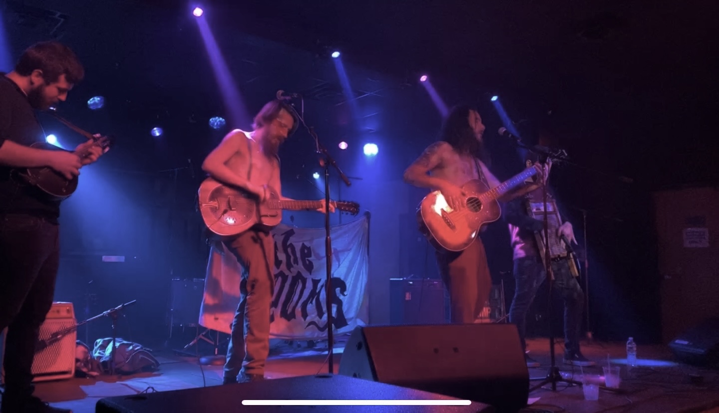 4 band members playing music