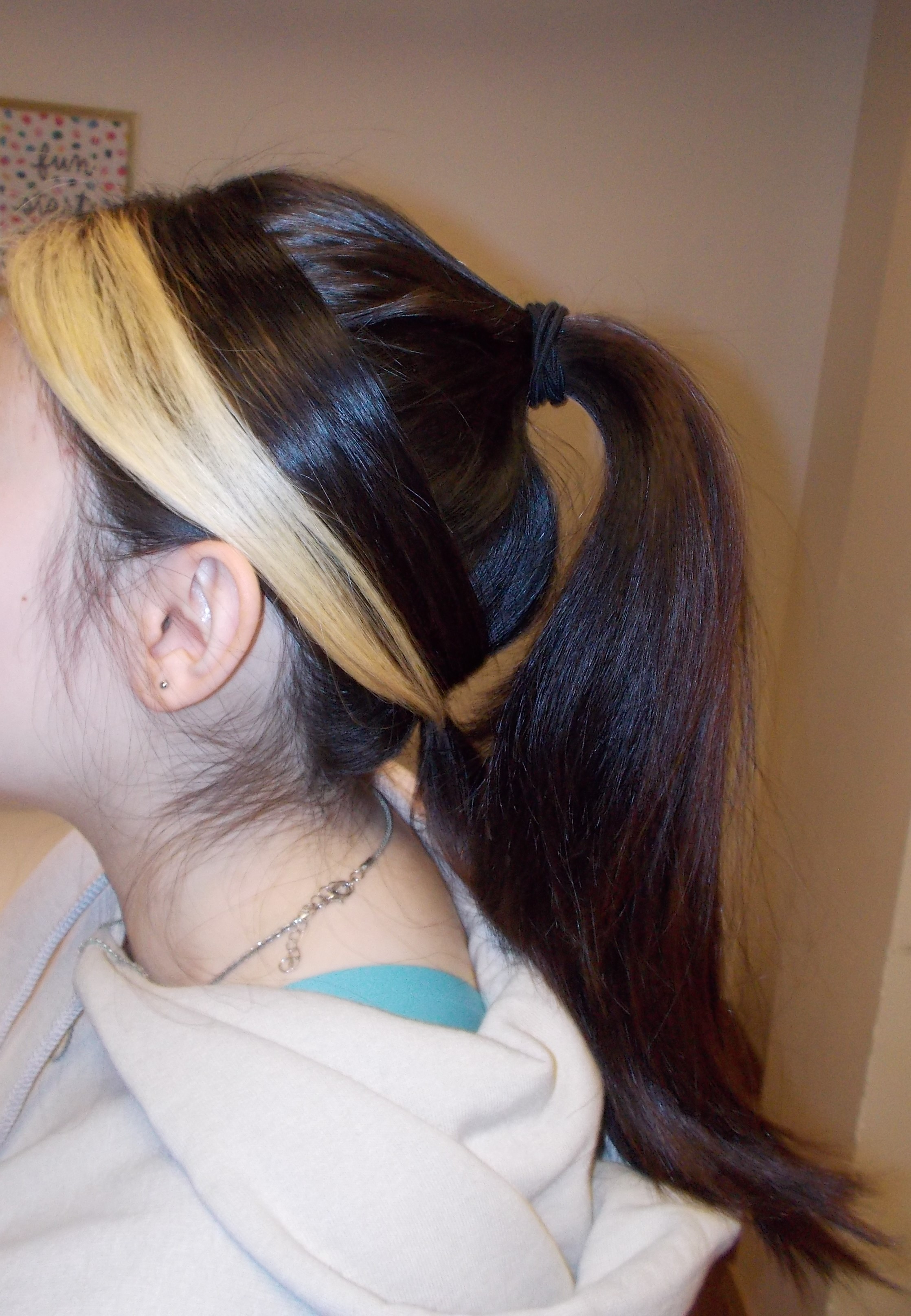 Back of woman\'s head showcasing hairstyle.