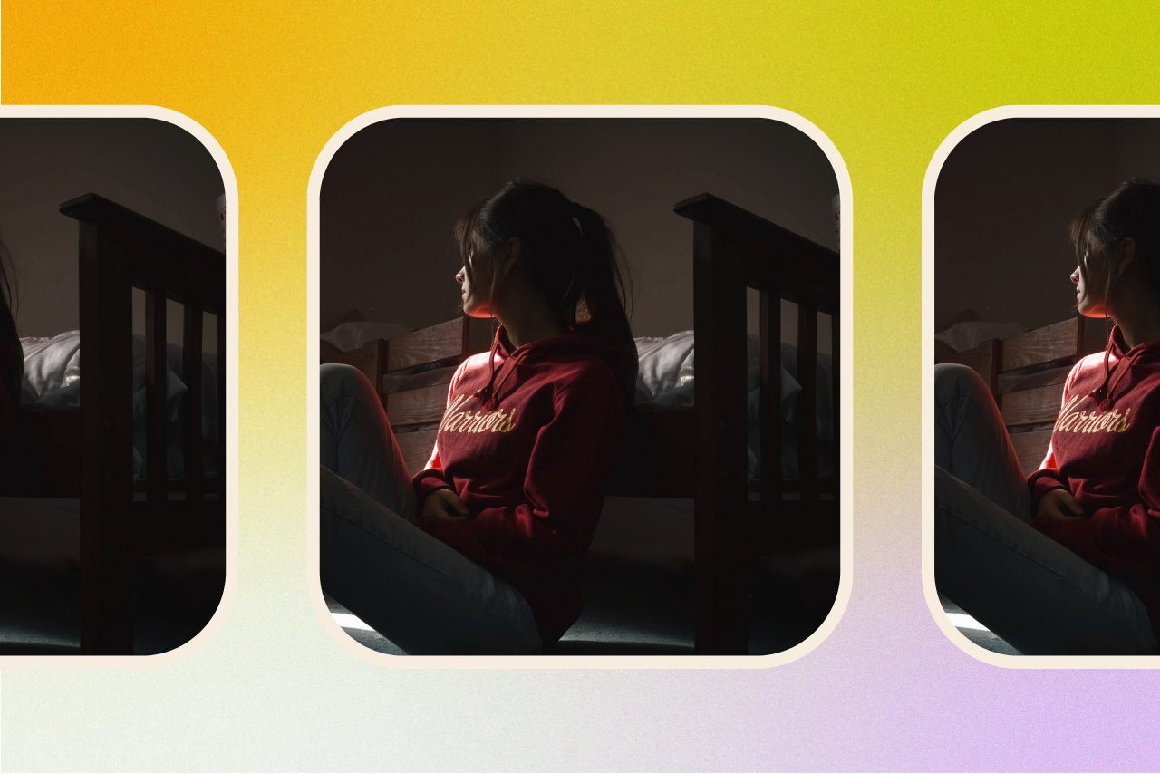 Woman sitting alone in a sad room.