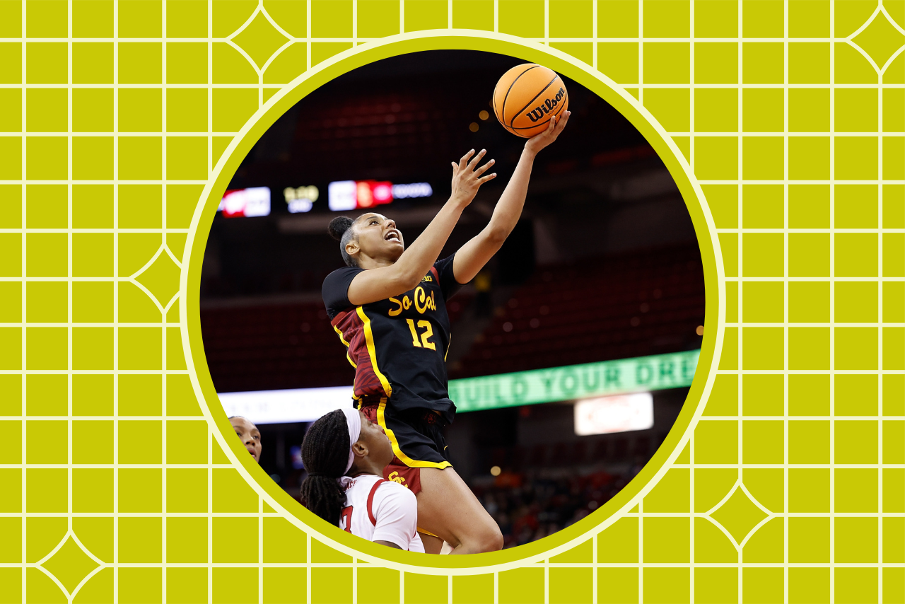 JuJu Watkins holding a basketball on the court