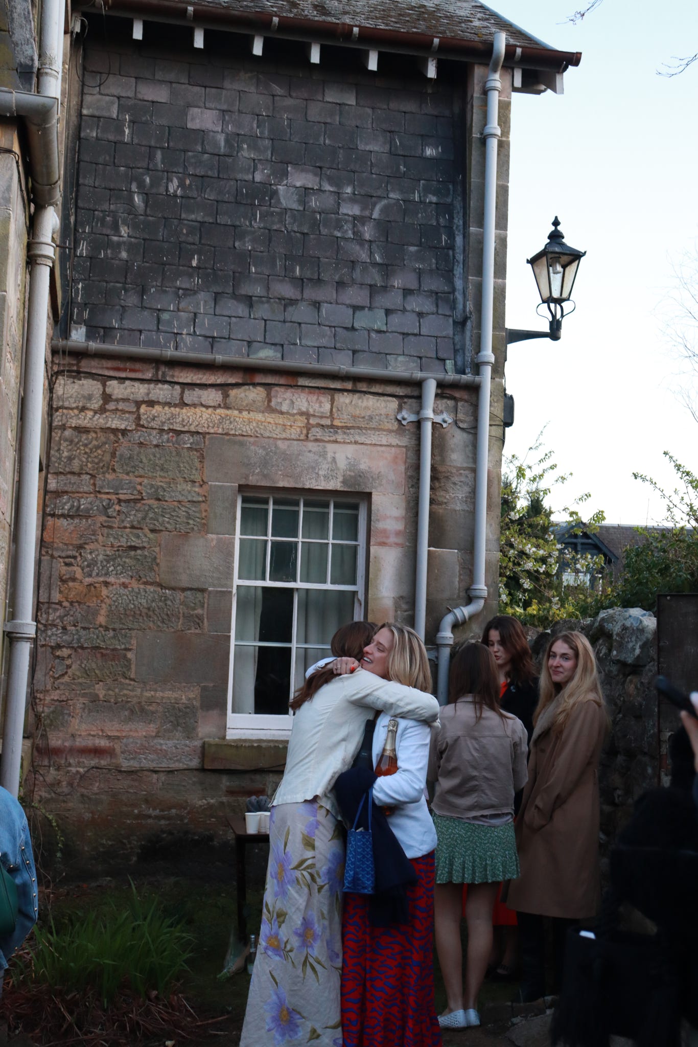 Image of two chapter members hugging during our end of year garden party