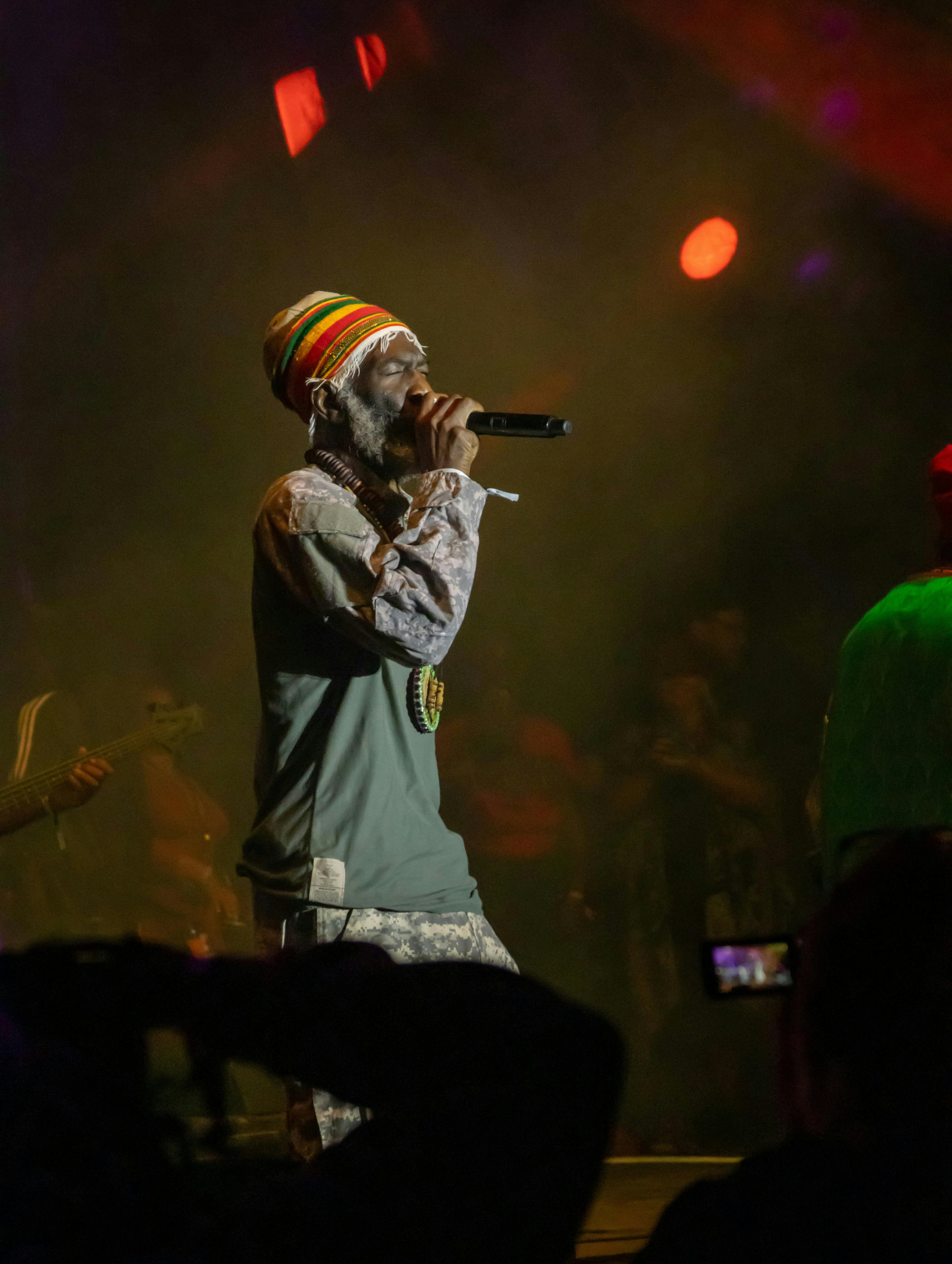 man singing on stage