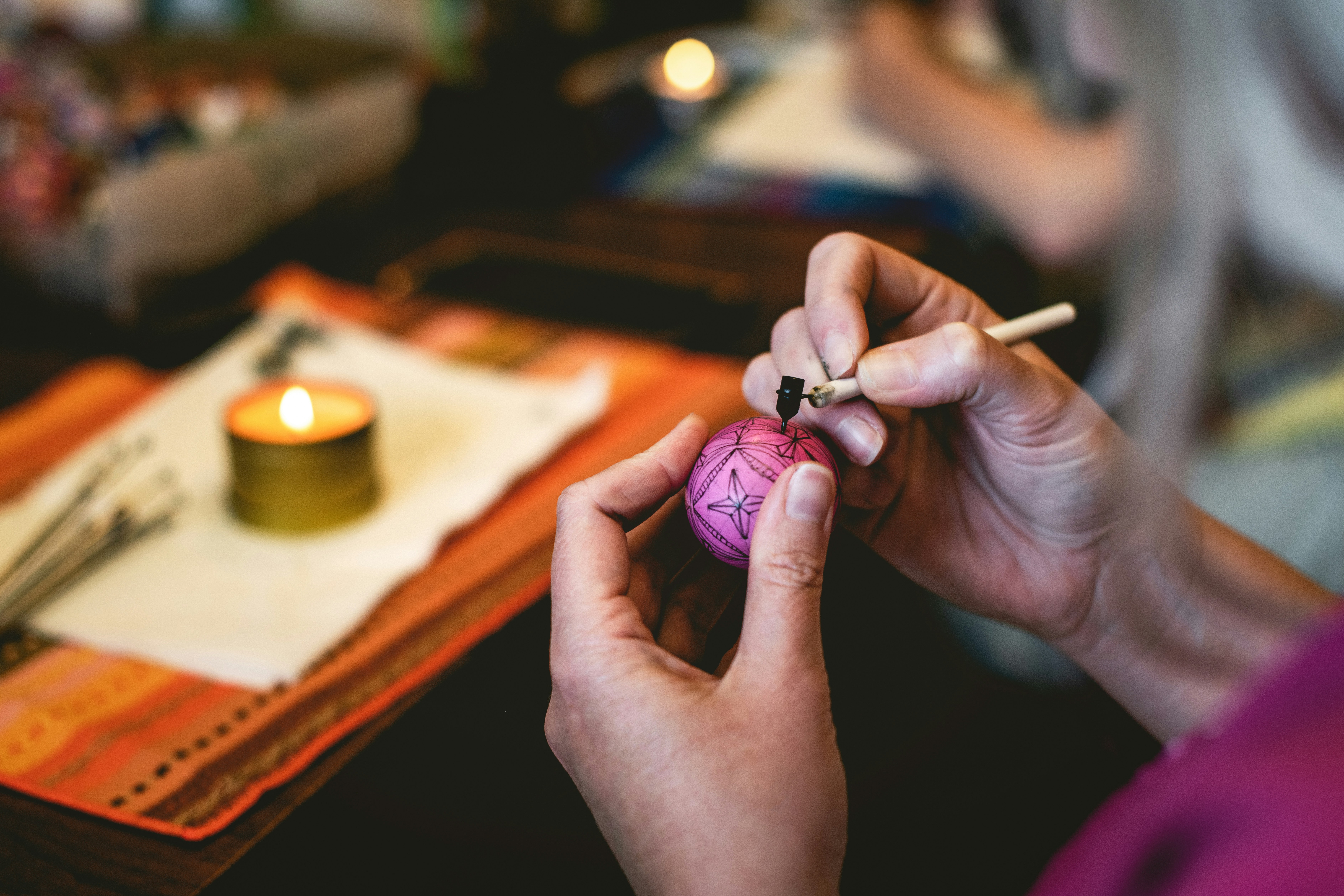 woman making pysanka eggs