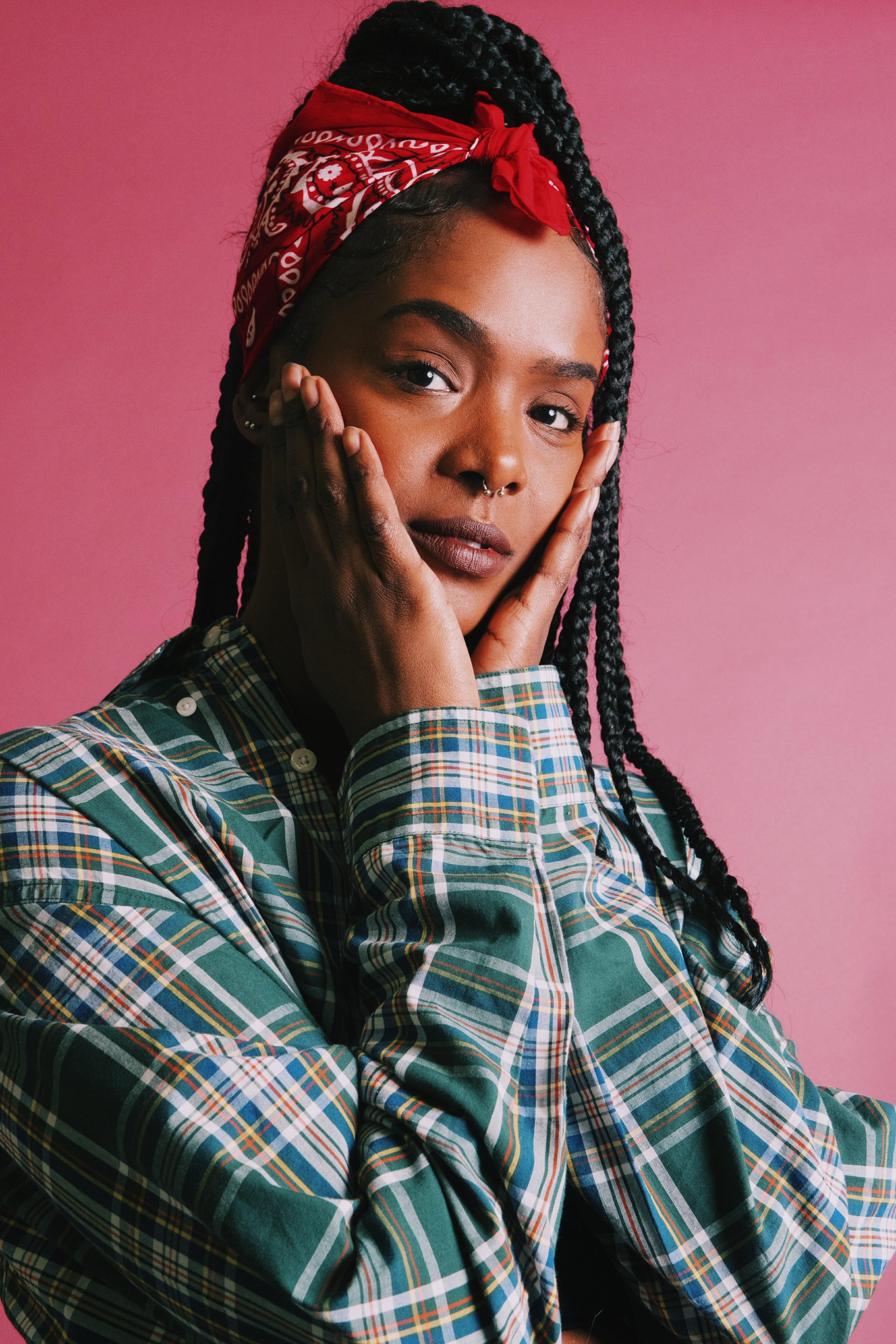 A girl using a red bandana