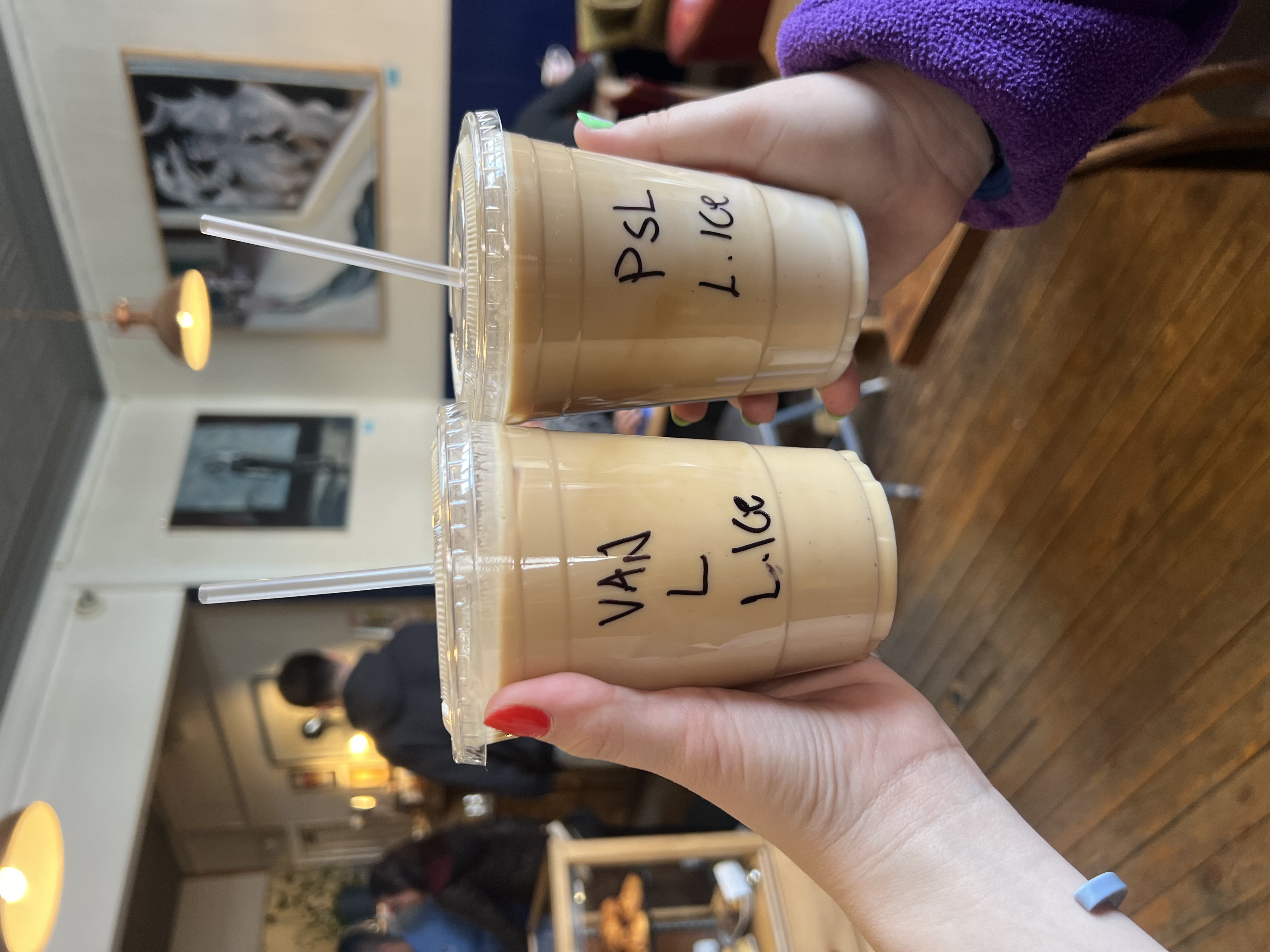 Two iced lattes in a coffee shop