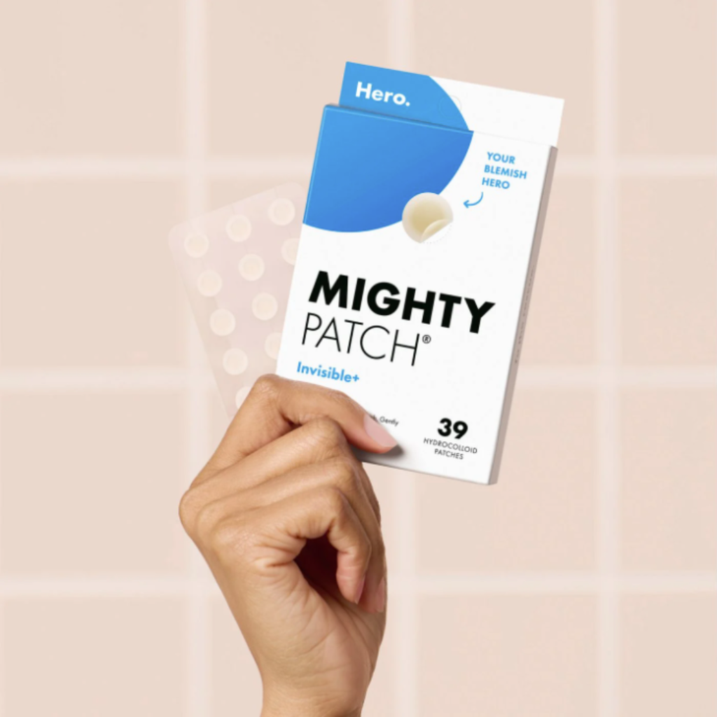 hand holding a box of pimple patches