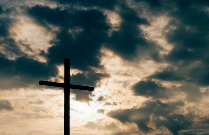 A cross against clouds.