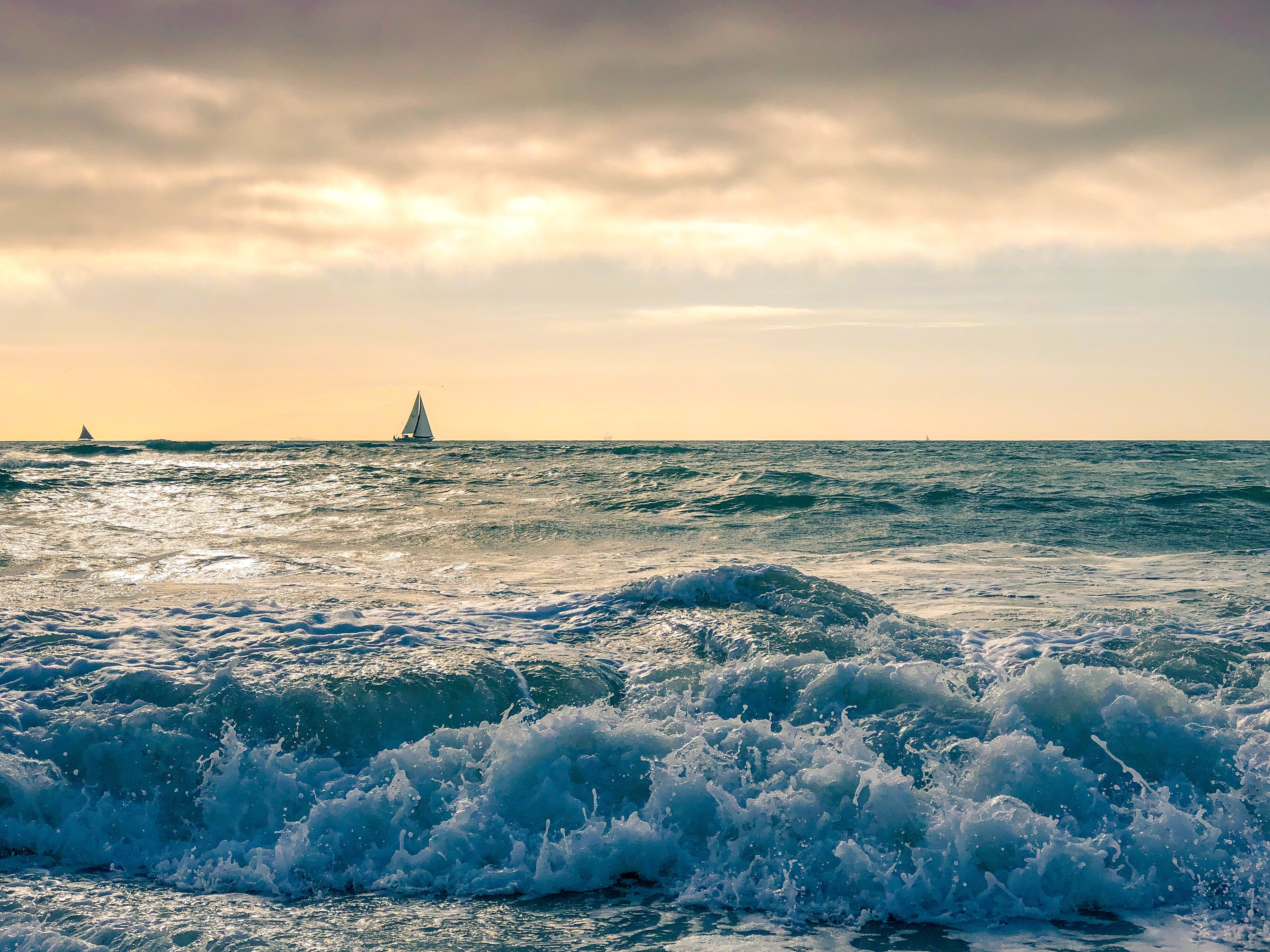 boat sailing the ocean by John Cea through Unsplash?width=698&height=466&fit=crop&auto=webp&dpr=4