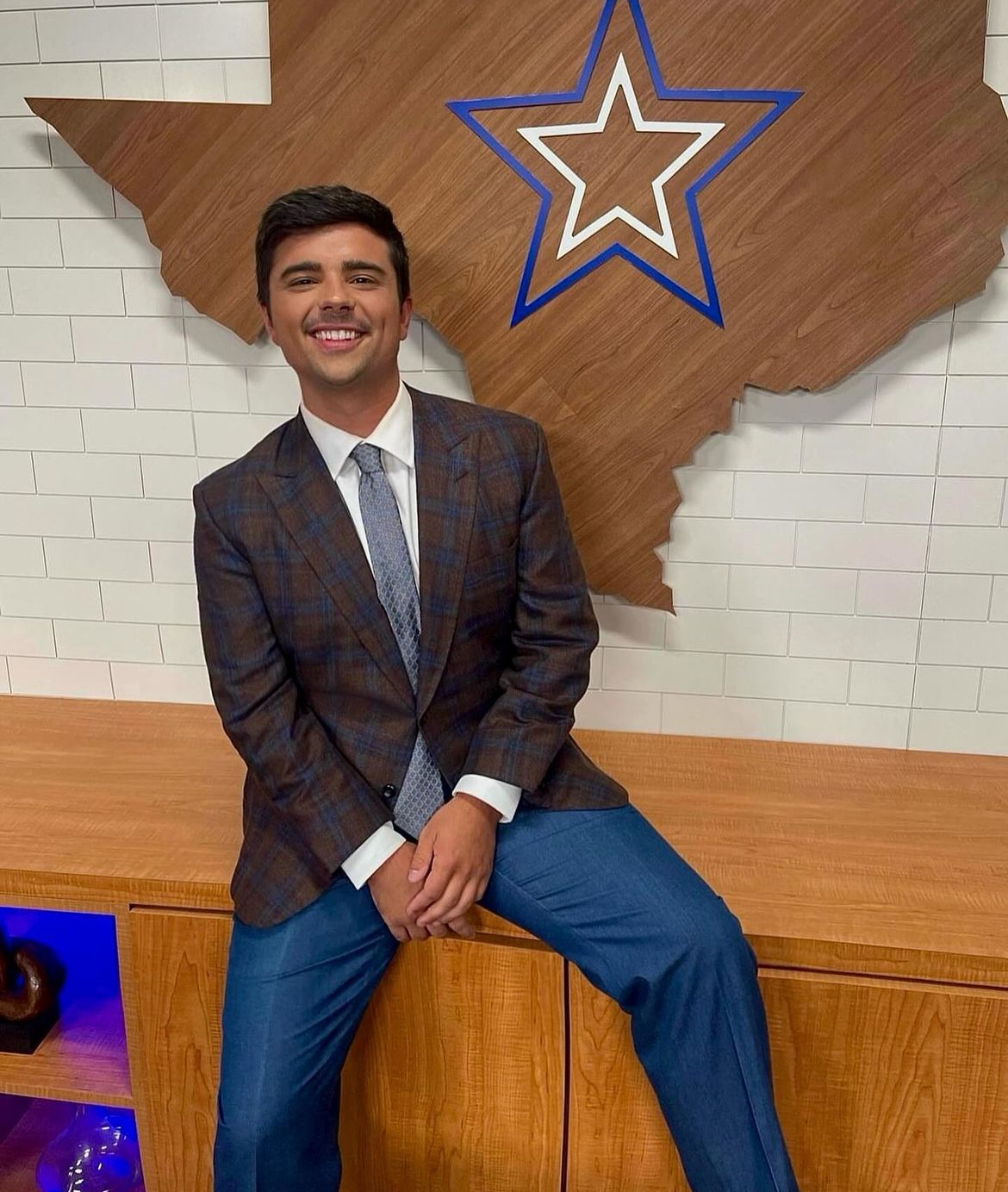 Ford Sandersat his work at a news station, and him at a festival