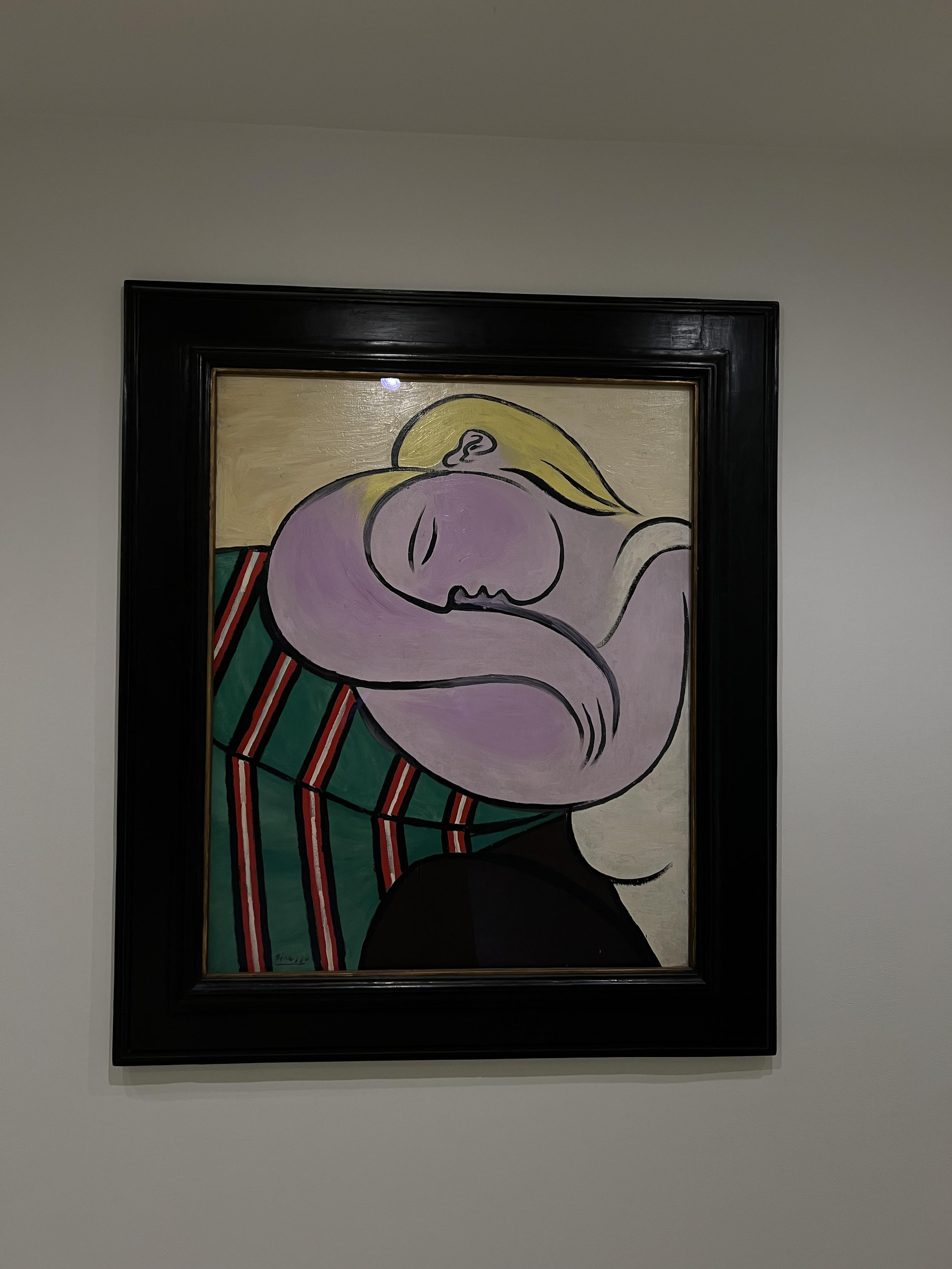 Picasso painting of a woman with purple skin and blonde hair