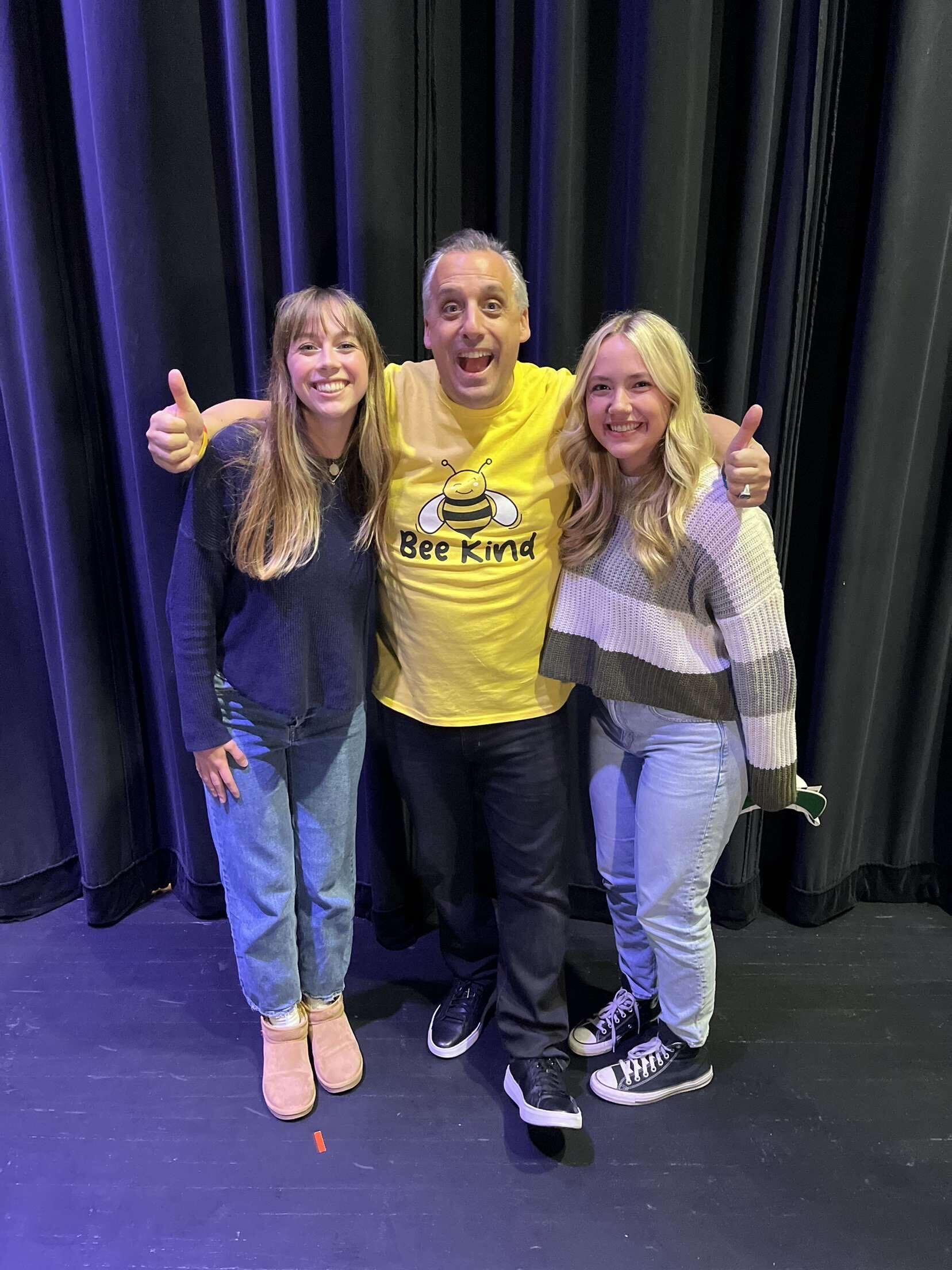 two girls standing with Joe Gatto