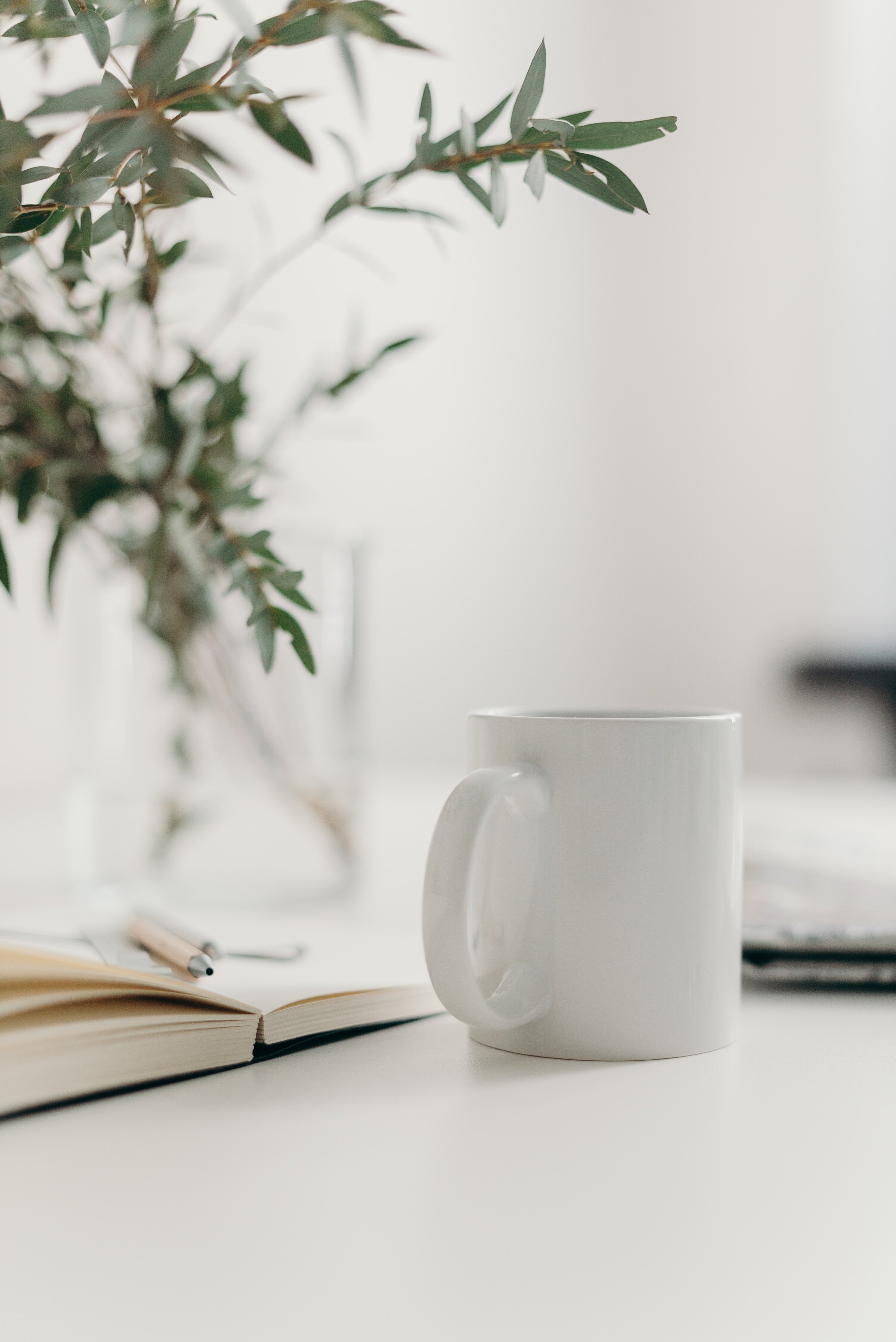 white ceramic mug on table