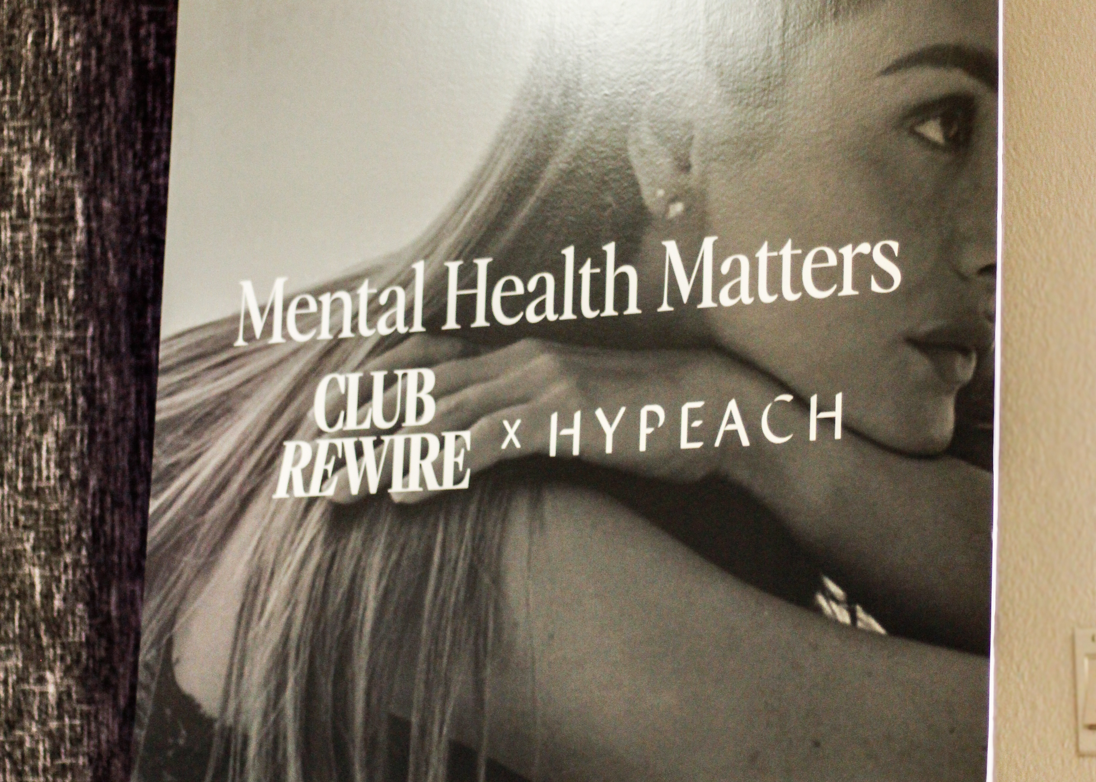 A board stating Club Rewire x Hypeach