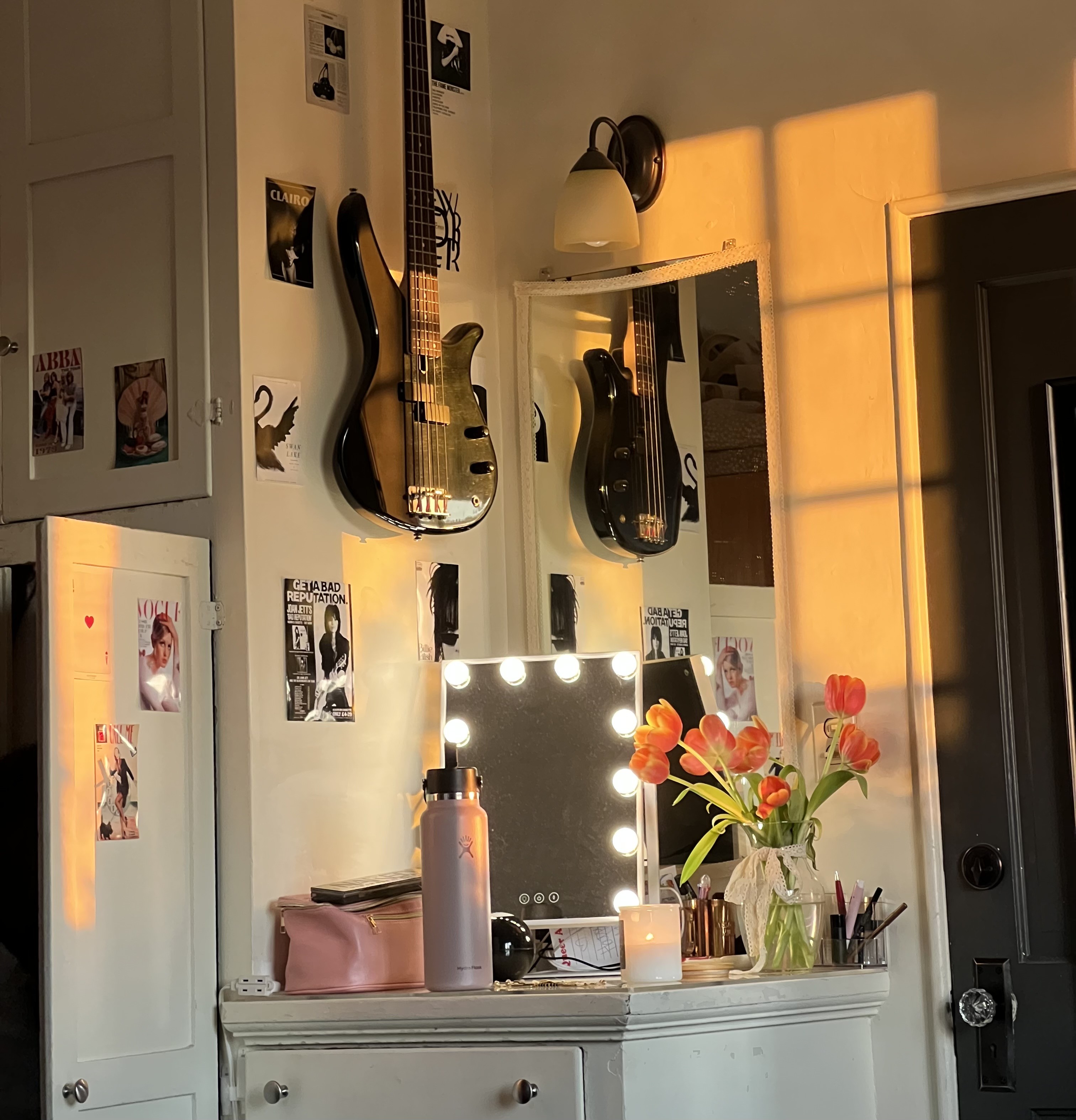 room with an electric guitar and a vanity