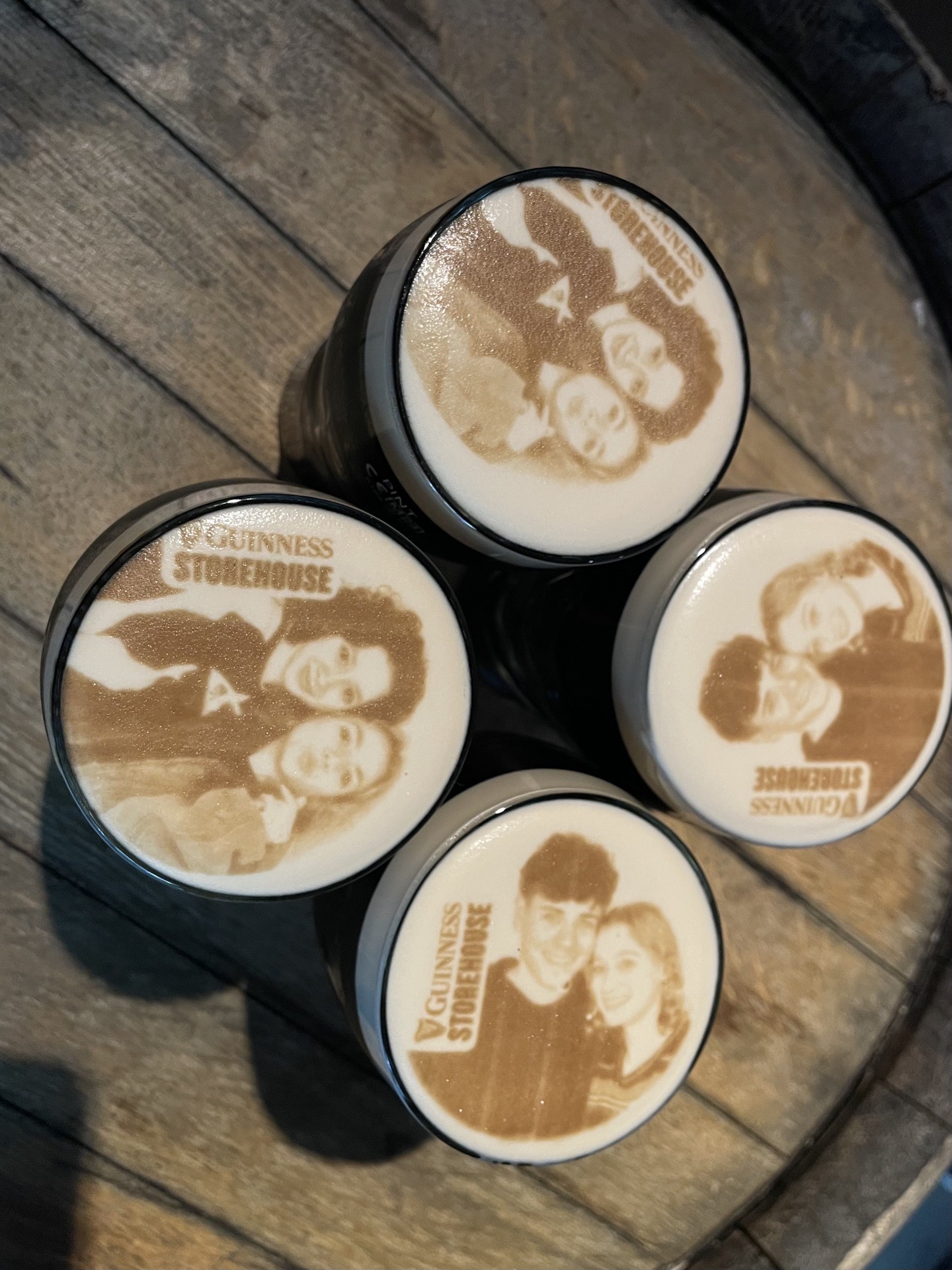 Glasses of Guinness customized with personal photos.
