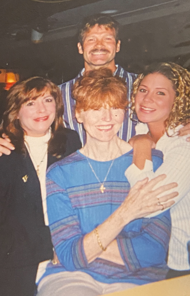 Grandmother, grandfather, nana and aunt all standing for a photo